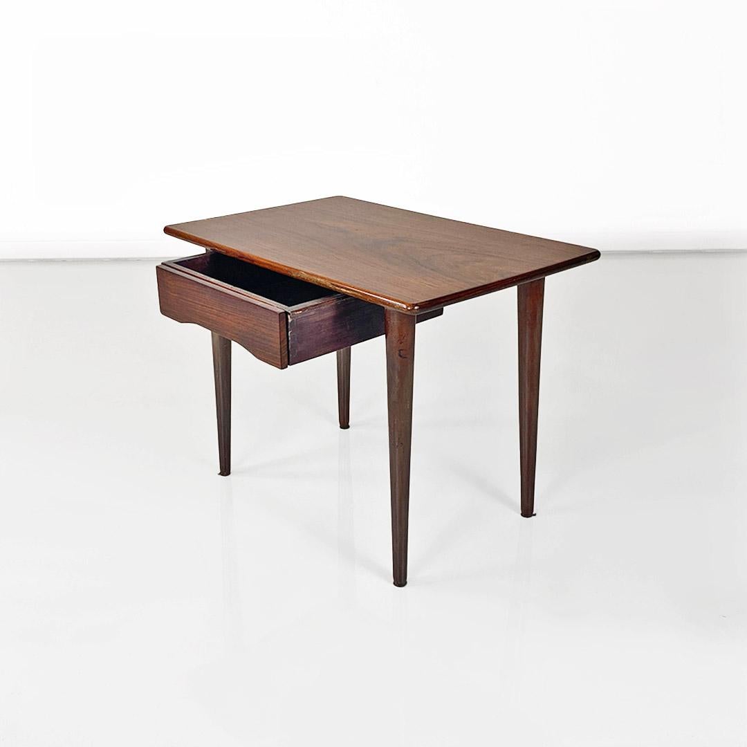 Scandinavian mid-20th-century wooden table with central drawer, ca. 1960.
Rectangular wooden top coffee table with a central drawer and easily removable round legs.
Of northern European origin, ca. 1960.
Excellent condition, a few scratches from