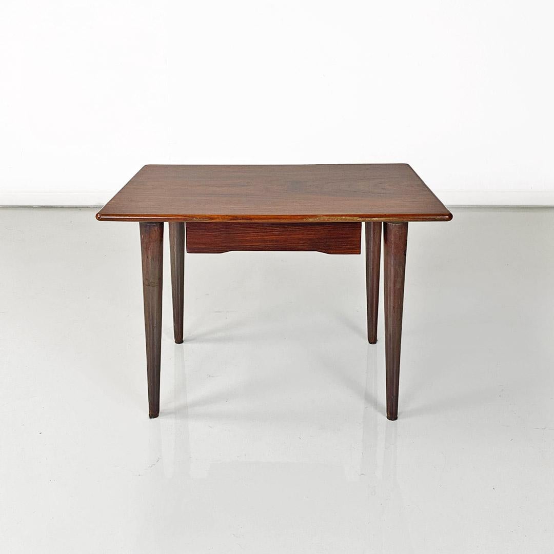 Wood Scandinavian mid-20th-century wooden table with central drawer, ca. 1960. For Sale