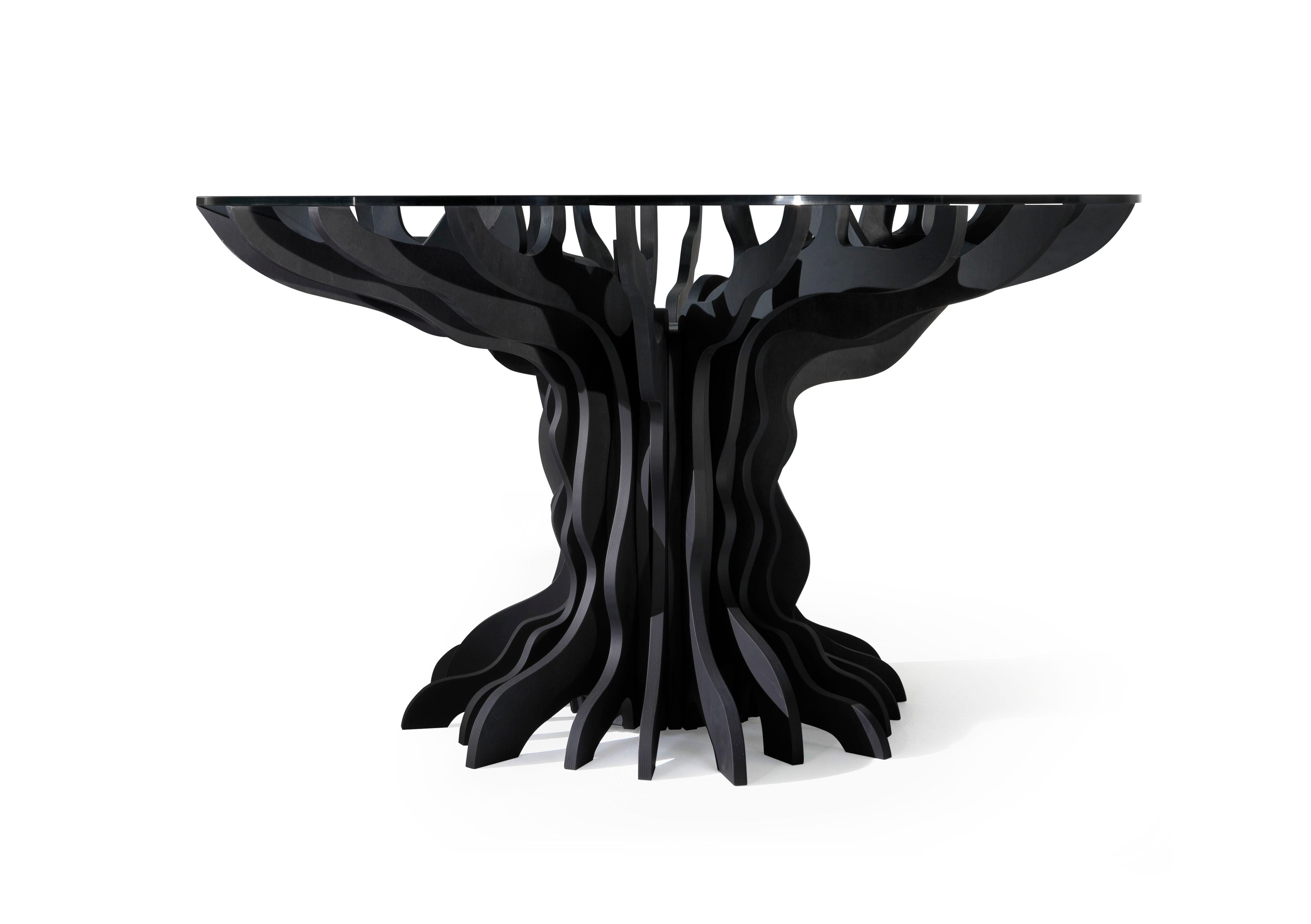 Sculptural table made of hand-finished birch plywood with natural or black painted finish. The suggested top is 140 cm in diameter but will support tops up to 180 cm in diameter