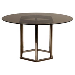 1970s round table with brass base and smoked glass