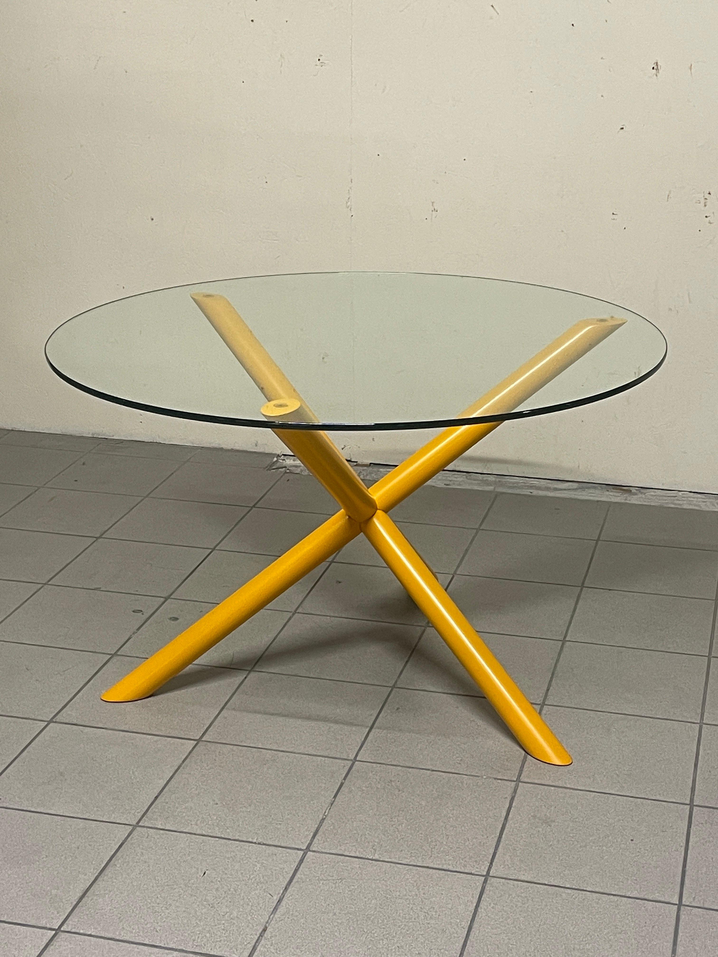 1970s round table with metal leg and crystal top.

The leg features three tubes crossed with each other with thick crystal top.

It should be noted that the crystal has a small chipping on one part of the outer side, which we also indicated in the