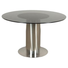 1970s round table in smoked glass and chrome-plated aluminum