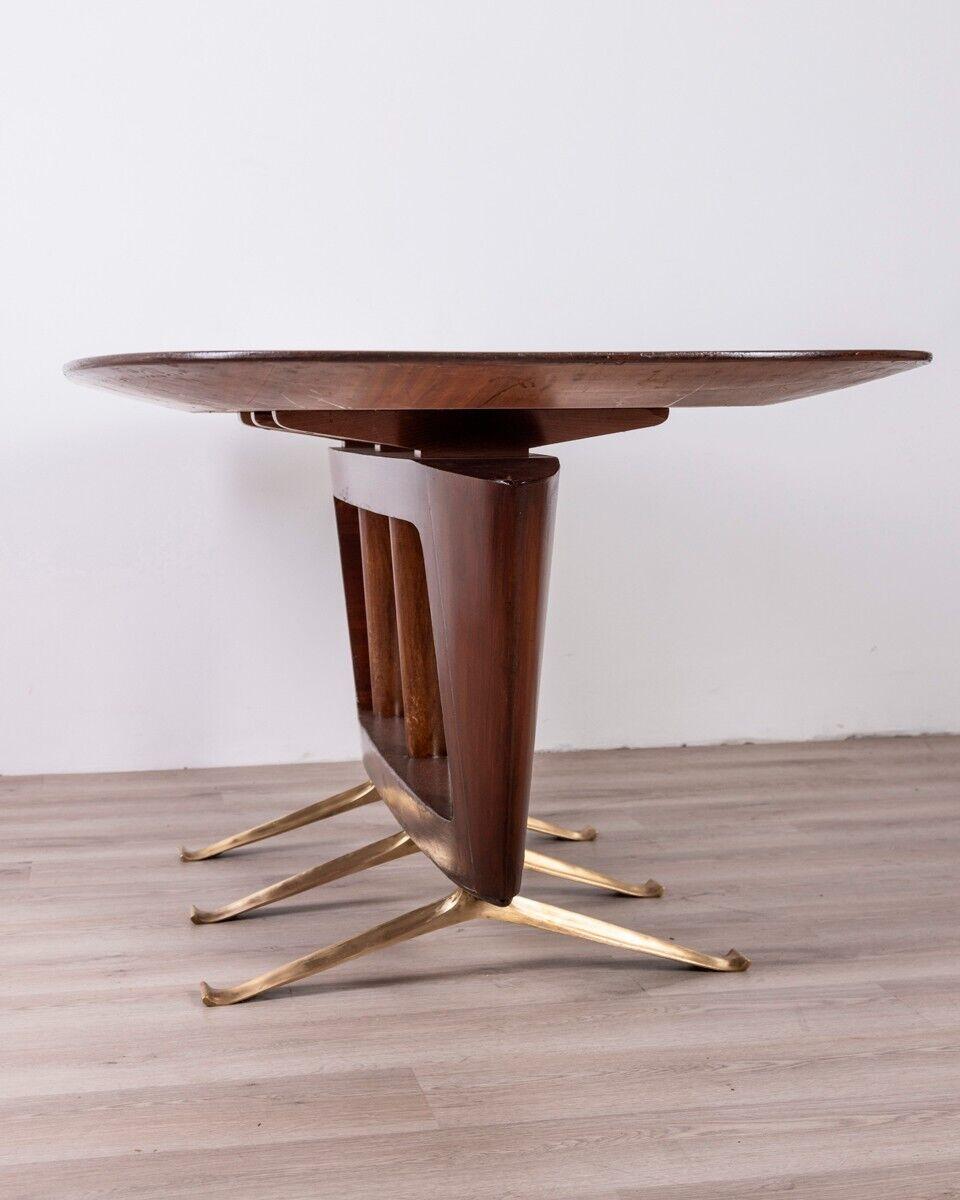 Table with gilt brass feet and wooden frame and top, design Melchiorre Bega, 1950s.

CONDITION: In good condition, partially restored, shows signs of wear given by time.

DIMENSIONS: Height 78 cm; Width 200 cm; Length 100 cm

MATERIAL: Brass and
