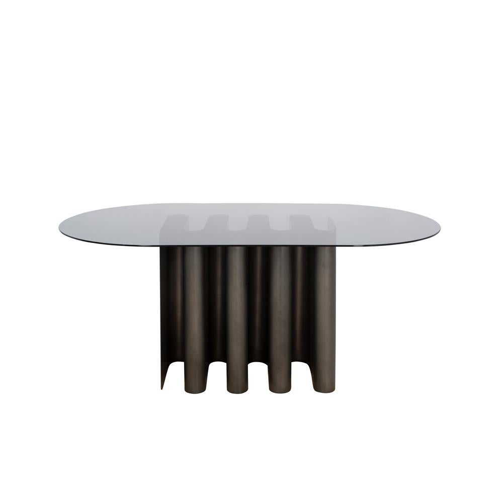 Tavolo2 smoky grey dining table by Pulpo
Dimensions: D180 x W100 x H75 cm
Materials: glass, aluminum

All color combinations available on request. 

Clear lines, avantgarde shape: Julia Chiaramonti’s design philosophy is inspired by the