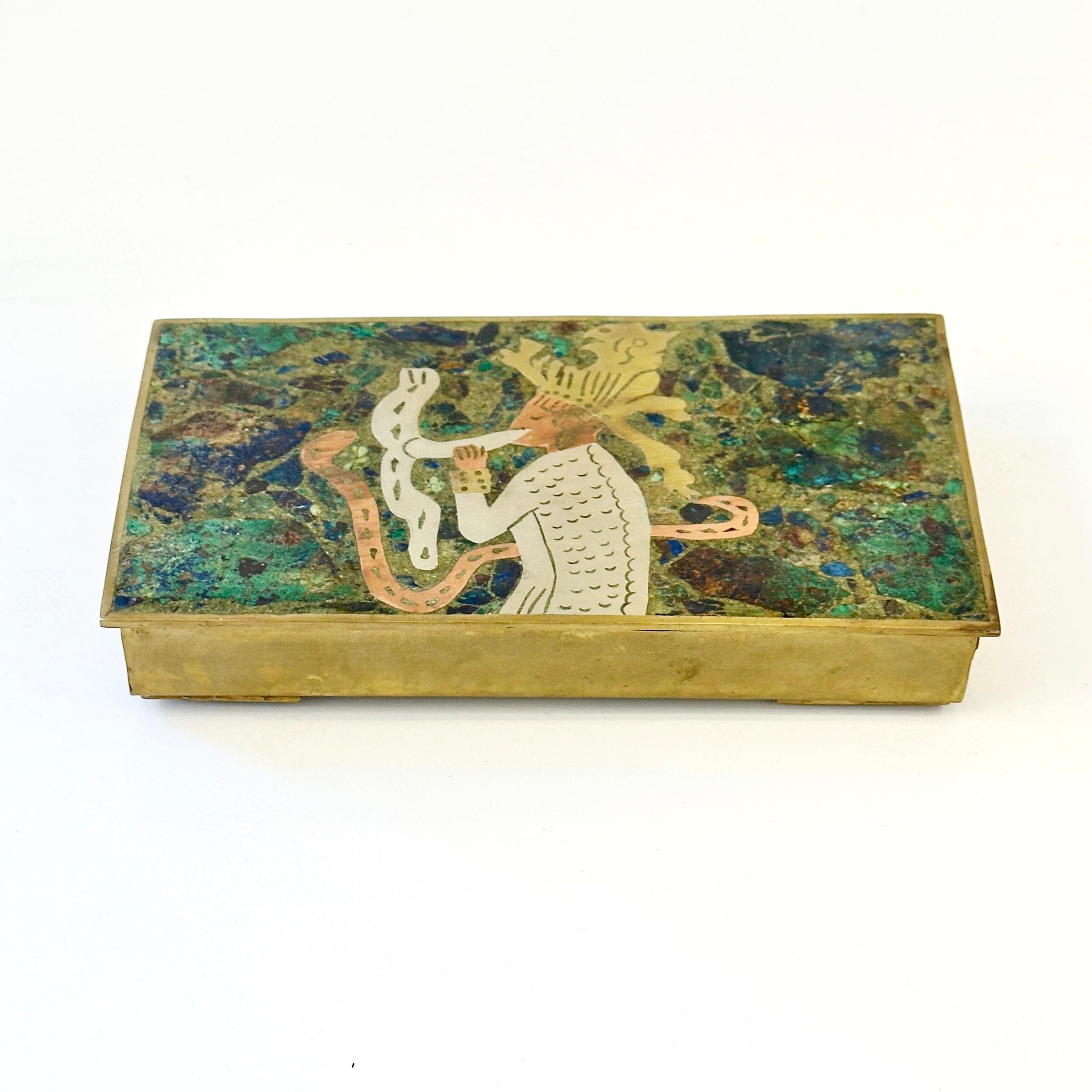 Taxco Mexico Brass and Azurite Malachite Snake Charmer Hinged Box, ca 1960s

Superb handwrought circa 1960s mixed metals - silver, copper and brass - inlay box by a skilled silversmith (maker unknown) from Taxco, Mexico. An abstract design featuring