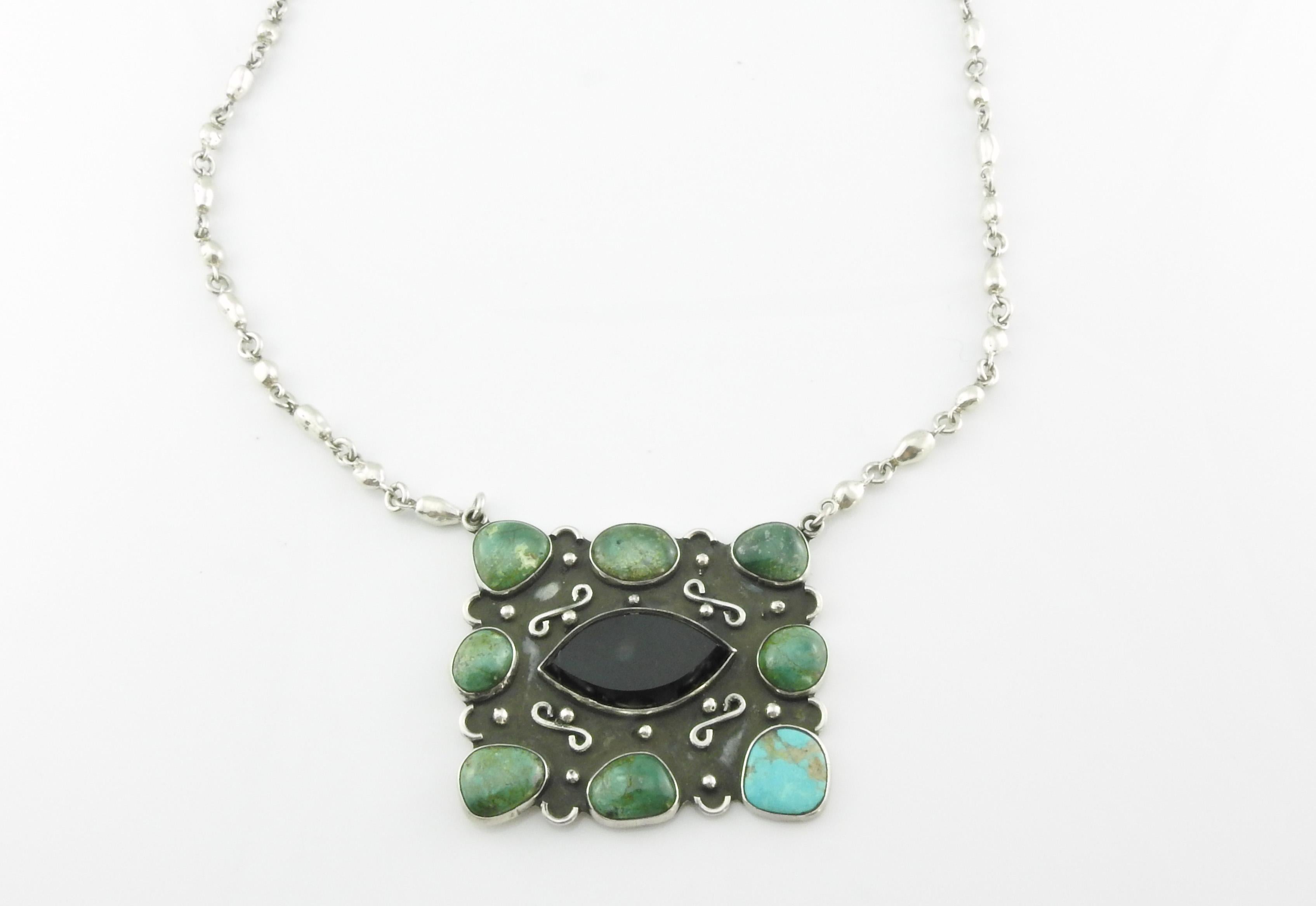 Taxco Mexico sterling silver with onyx and turquoise panel pendant necklace by Rodolfo Espinoza.

Marked: REH TE-06 Taxco

Measures: 20