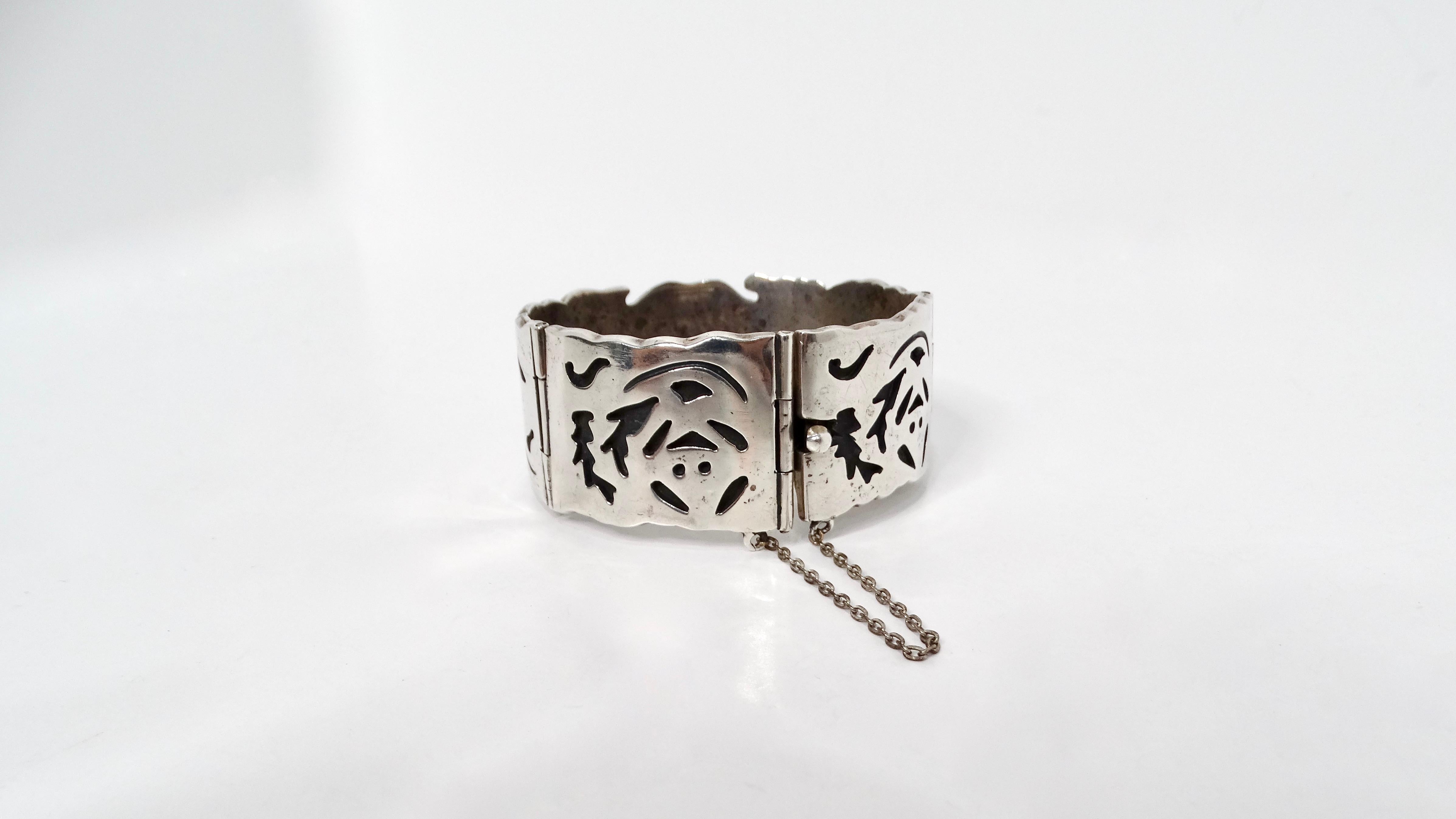 The Vintage Taxco Mexico Sterling Silver Cuff Bracelet is a stunning example of artisanal craftsmanship, featuring a rich, handcrafted design that highlights its 32.5% sterling silver composition. Each bracelet is meticulously carved, showcasing
