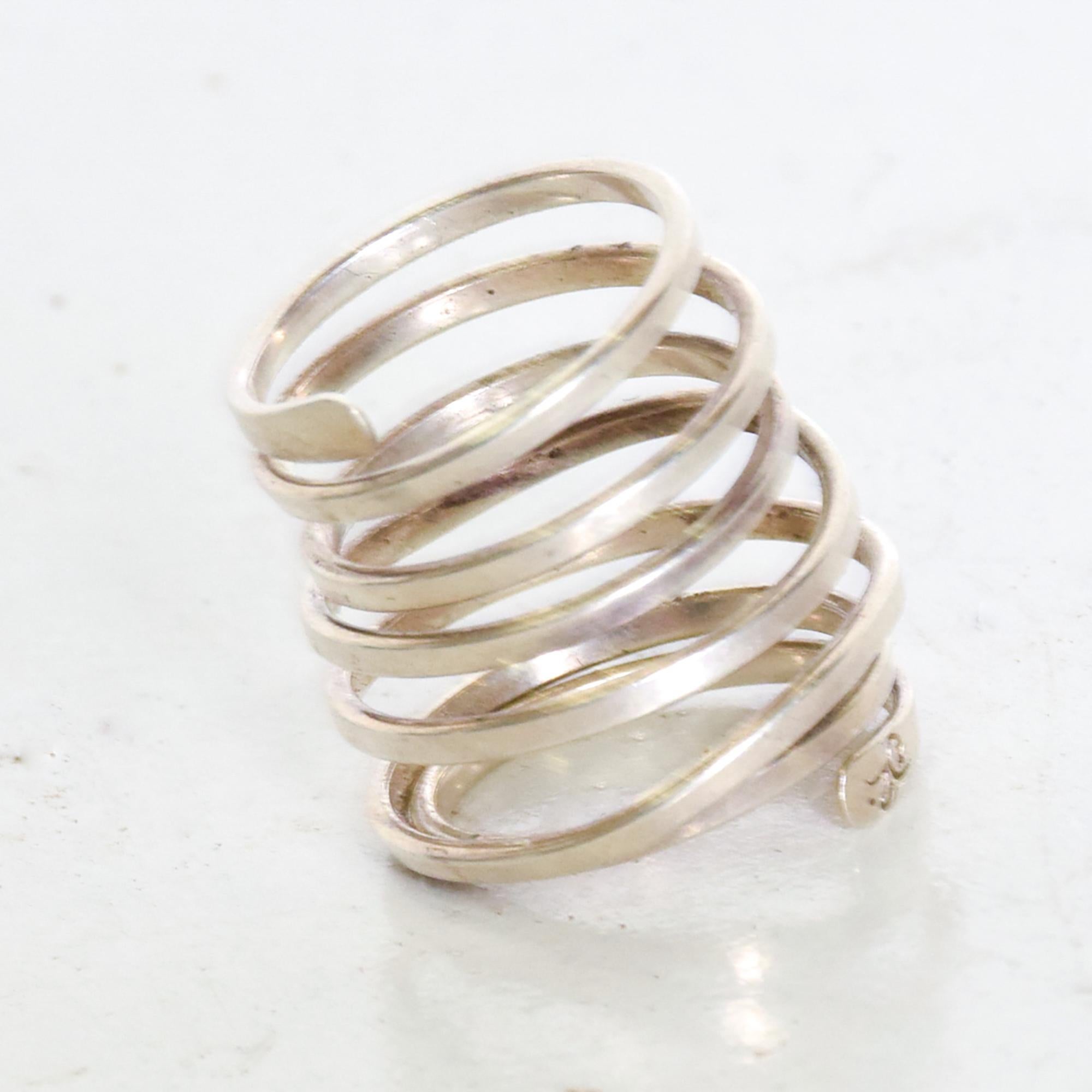 For your consideration: Mid century Taxco modernism sterling silver Artisan coiled spiral serpent wrap -around fashion ring.
Stamped, signature markings hard to read. In the manner of Los Castillo.
Dimensions: 1