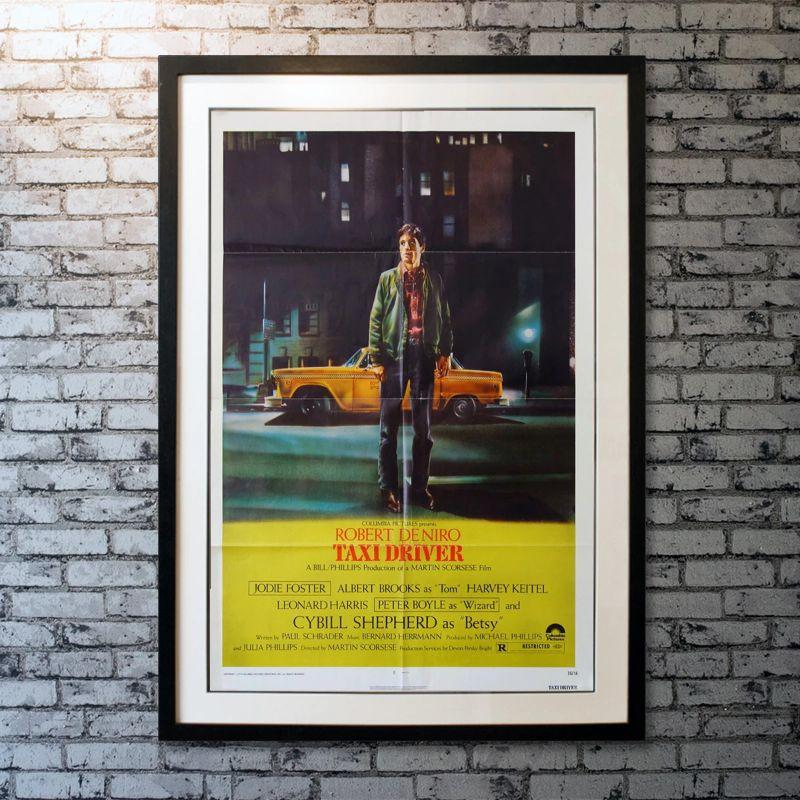 Taxi Driver, Unframed Poster, 1976

Original One Sheet (27 x 41 inches). A mentally unstable veteran works as a nighttime taxi driver in New York City, where the perceived decadence and sleaze fuels his urge for violent action by attempting to