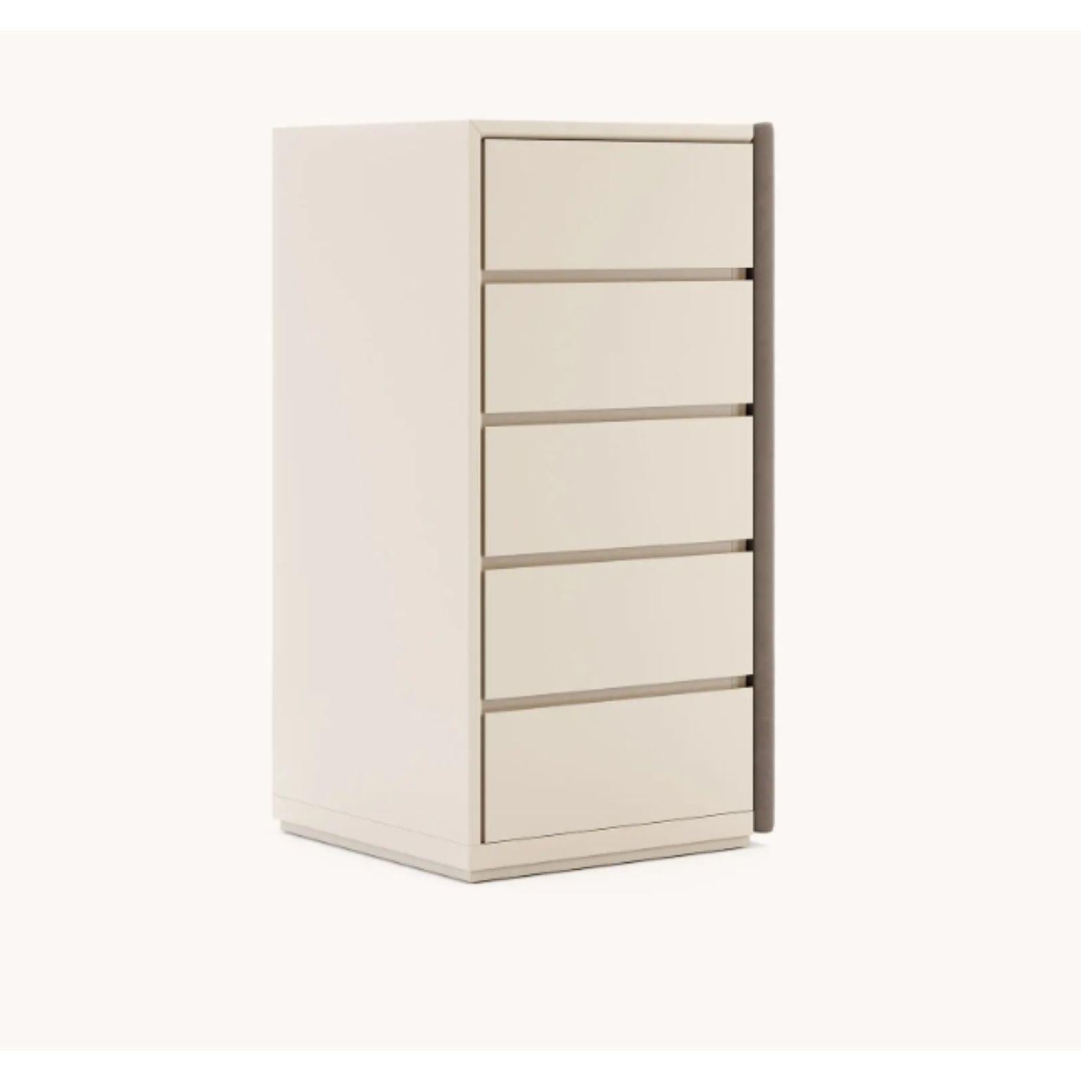 Taylor dresser with 5 drawers by Domkapa
Dimensions: W 61 x D 60 x H 120 cm.
Materials: Moka lacquered matte, microfiber (Tarn 05).
Also available in different materials.

Taylor is a set of three-bedroom furniture pieces for cozy decor.