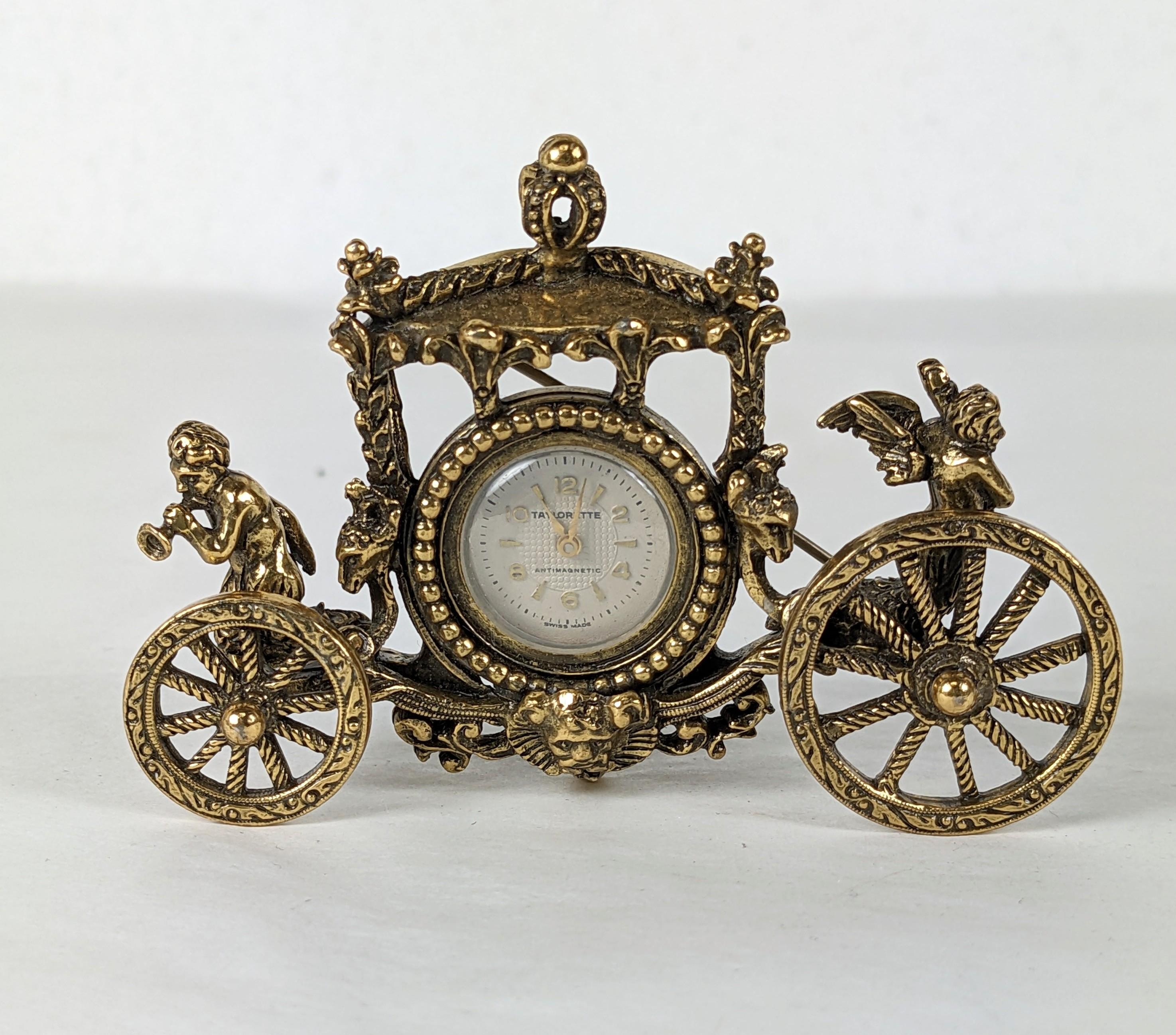 Wonderful Taylor Novelty Stage Coach Watch Brooch from the 1940's. Gilt metal with cherubs announcing the arrival of the Roccoco coach above each wheel.  
Watch works when tested.  3