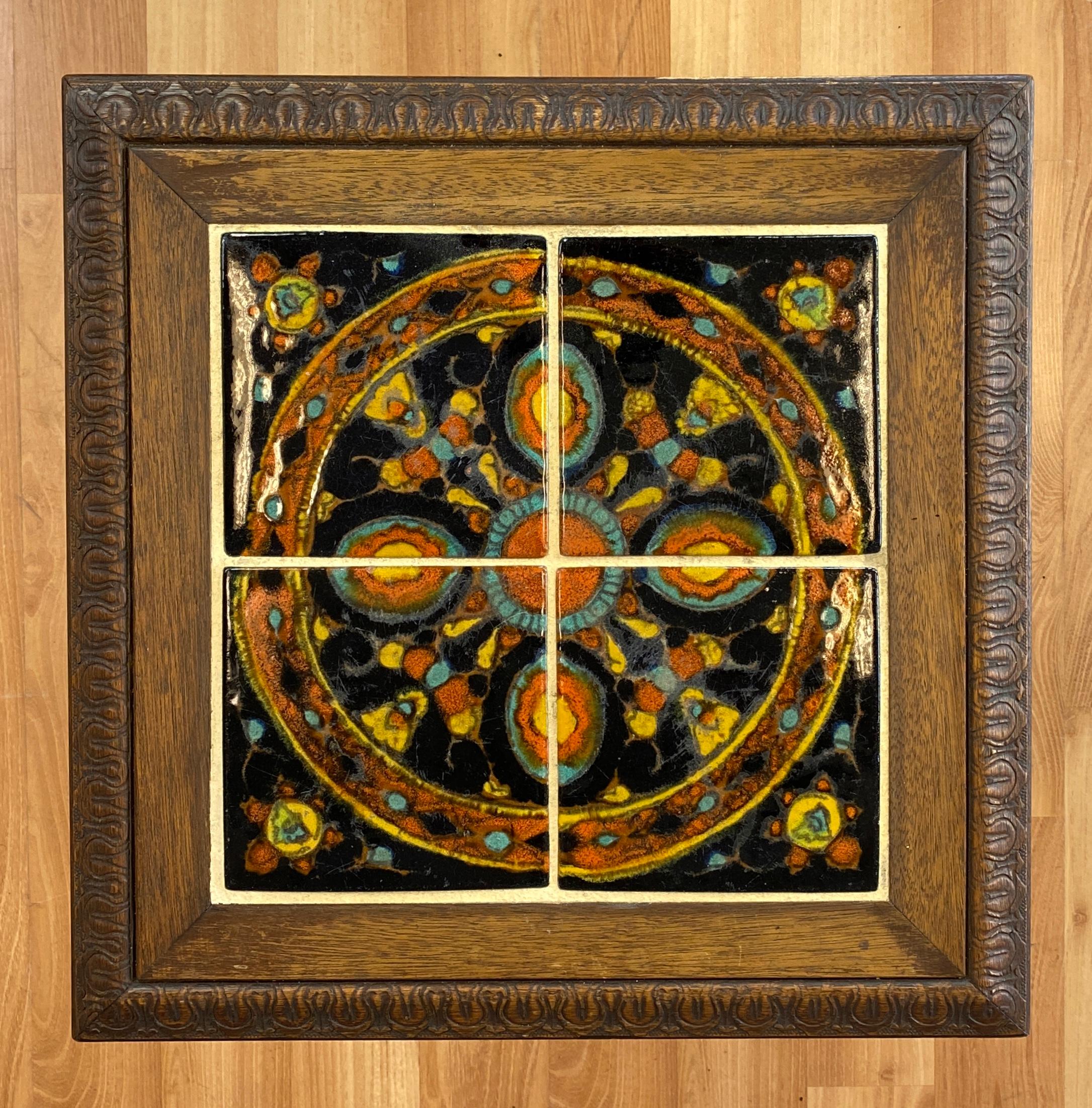 Offered here is a circa 1930s Mission style tile top table by Taylor Tilery
Believe it's California oak, stretchers between the legs that are holding of a four tile top, nice colors
Black, burnt orange, teal, yellow and a little brown in there. A