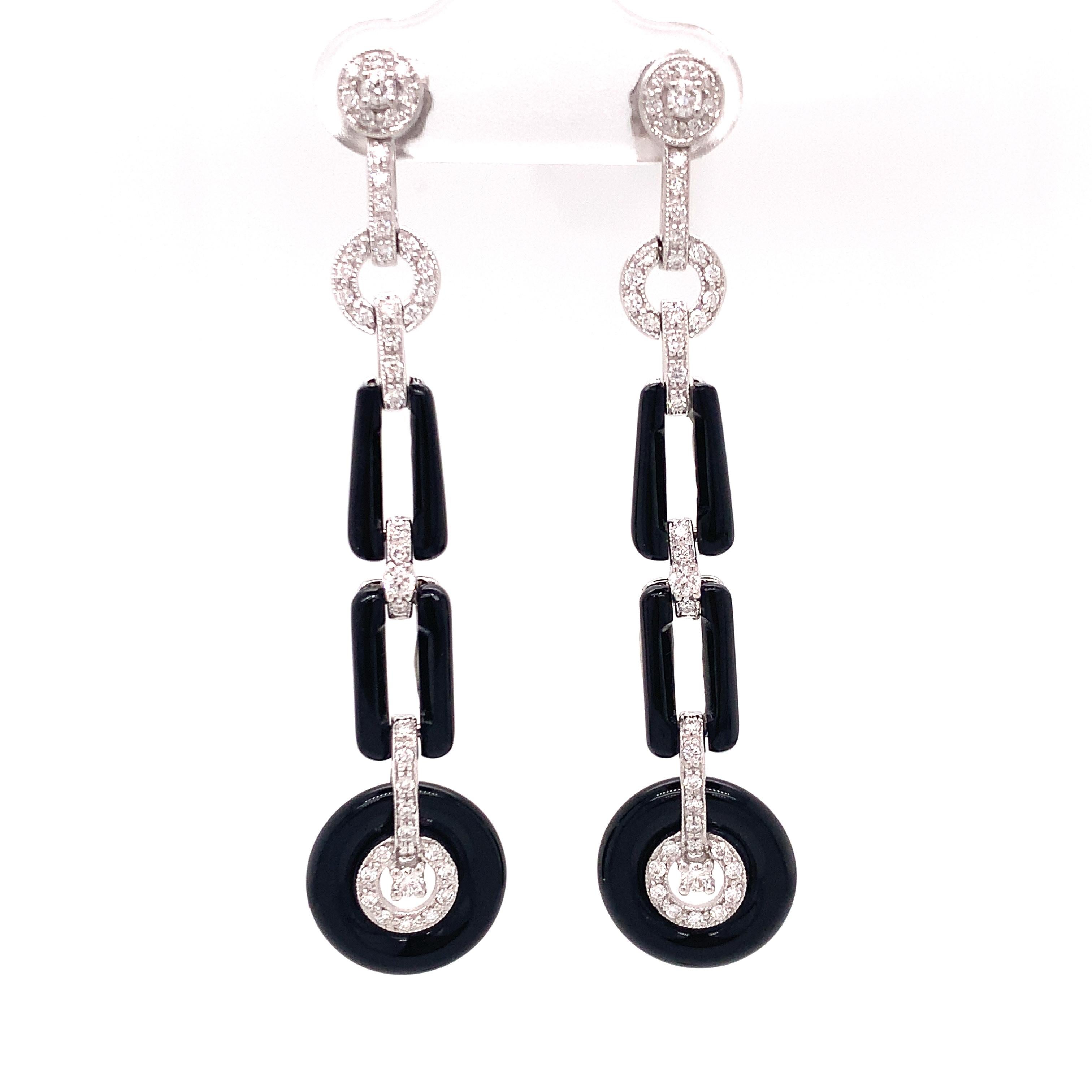 A TB favorite!  Vintage inspired art deco style drop earrings, Great Gatsby approved.  These spectacular two inch drop earrings are expertly crafted from 6.74 ct in onyx contrasting with .57 ctw in diamonds.  Set in 18kt white gold. 
  
Art Deco was