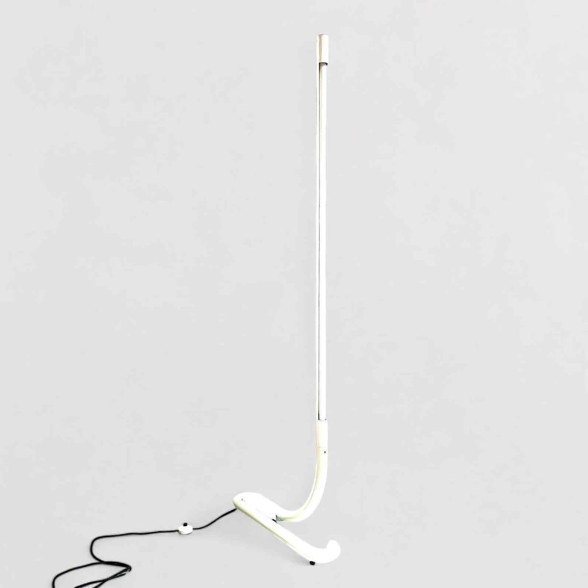 Aldo van den Nieuwelaar’s *TC 2* floor lamp, designed in 1969 and produced in 1972, is a hallmark of minimalist Dutch modern design. Standing at 196.0 x 73.0 x 15.0 cm, it features lacquered metal with a TL light, blending geometric elegance with
