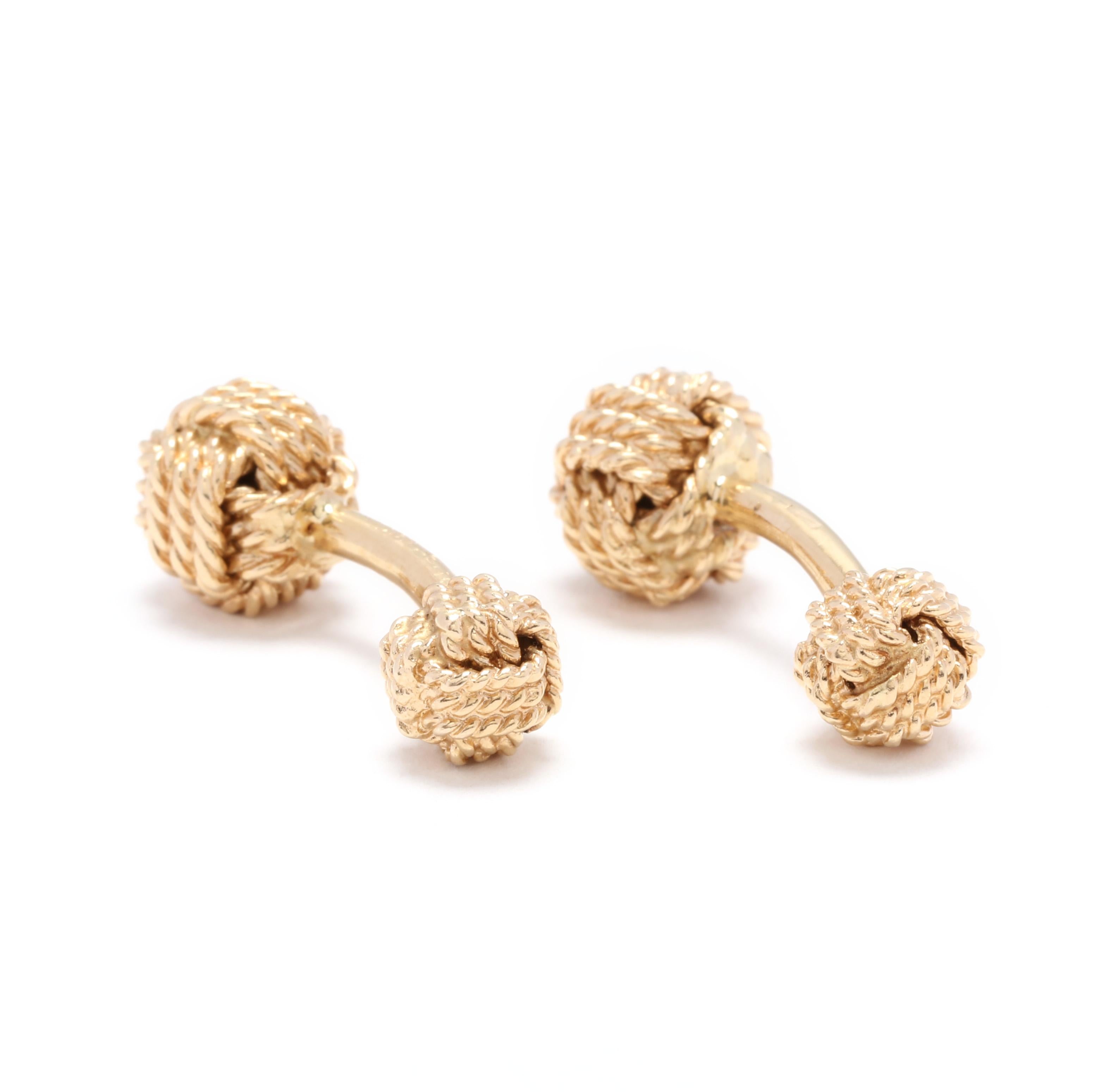 A pair of vintage 14 karat yellow gold Tiffany and Company knot cufflinks. These cufflinks features a large rope motif knot at one end and a small rope motif knot at the other end.



Length: 1 1/8 in.



Width: 7/16 in.



Weight: 7.5 dwts.
