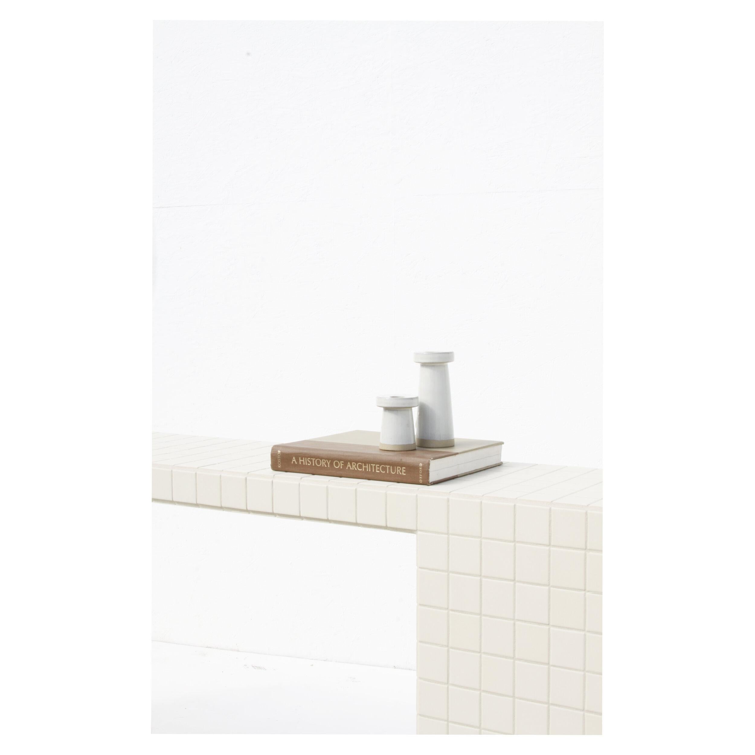 Designed and made by Nima Abili in Los Angeles this handcrafted table is cladded with almond beige matte porcelain tiles and sanded beige grout. Inspired by Brutalist style of architecture this collection offers a variety of pieces designed based on
