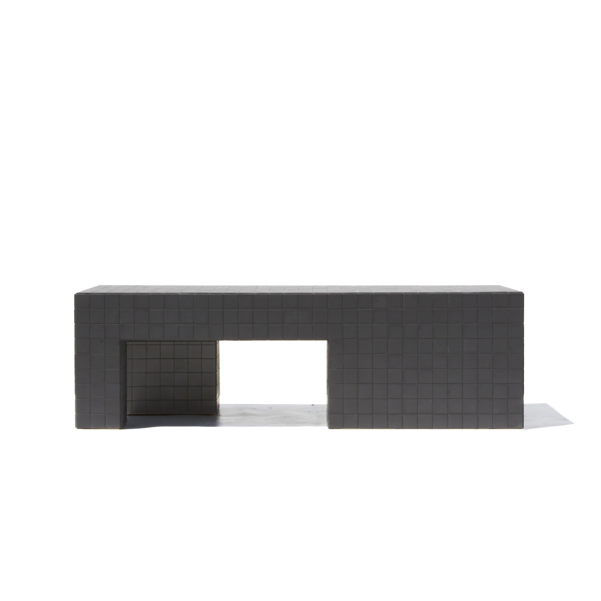 Designed and made by Nima Abili in Los Angeles this handcrafted table is cladded with black matte porcelain tiles and sanded black grout. Inspired by Brutalist style of architecture this collection offers a variety of pieces designed based on the