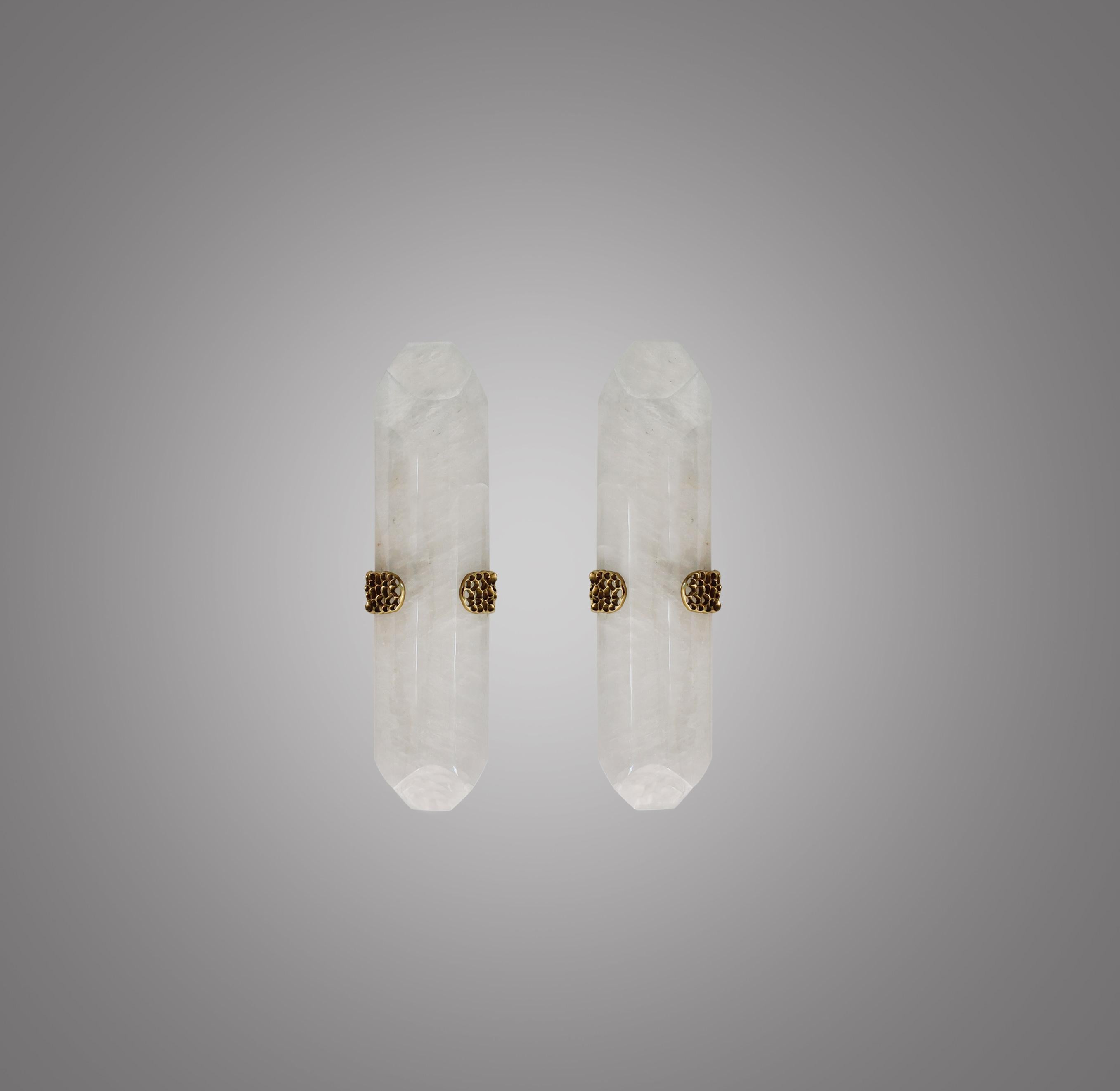 Pair of TDW rock crystal sconces with polish brass decoration. Created by Phoenix Gallery, NYC.
Each sconce installs 2 sockets. 120watts max. Led light bulbs supplied.
Custom size and metal finish upon request.