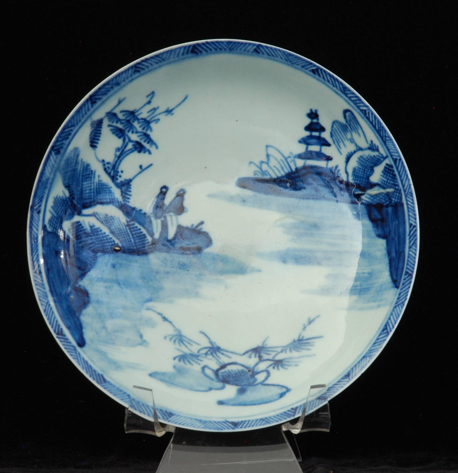 A porcelain tea bowl and saucer from one of the Liverpool makers, painted with a chinoiserie scene. The use of the white porcelain to form the shine on the river is very pleasing.