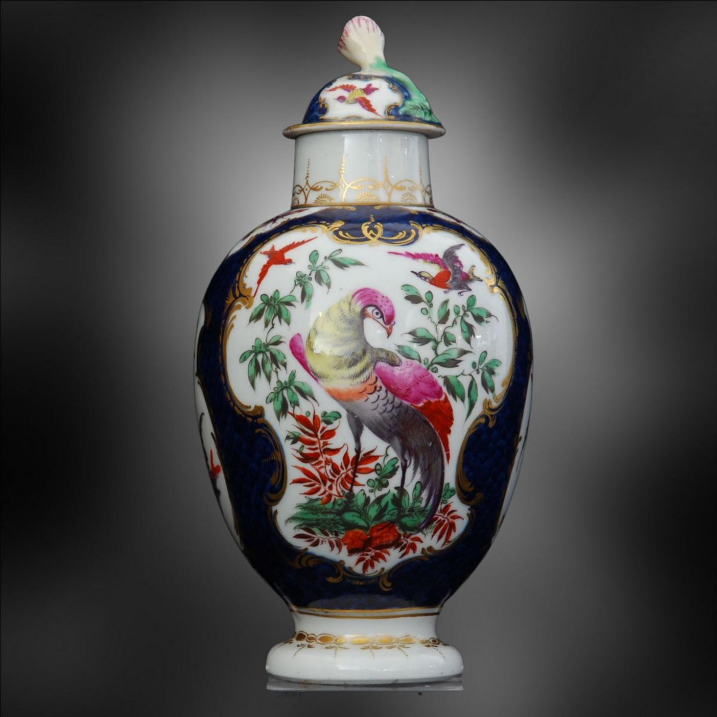 A small oviform tea canister, decorated with a scale blue ground and exotic birds and insects to the reserves.

Tea was a new, fashionable, and expensive drink at the time this was made. It would have been part of a large service, the pride of the