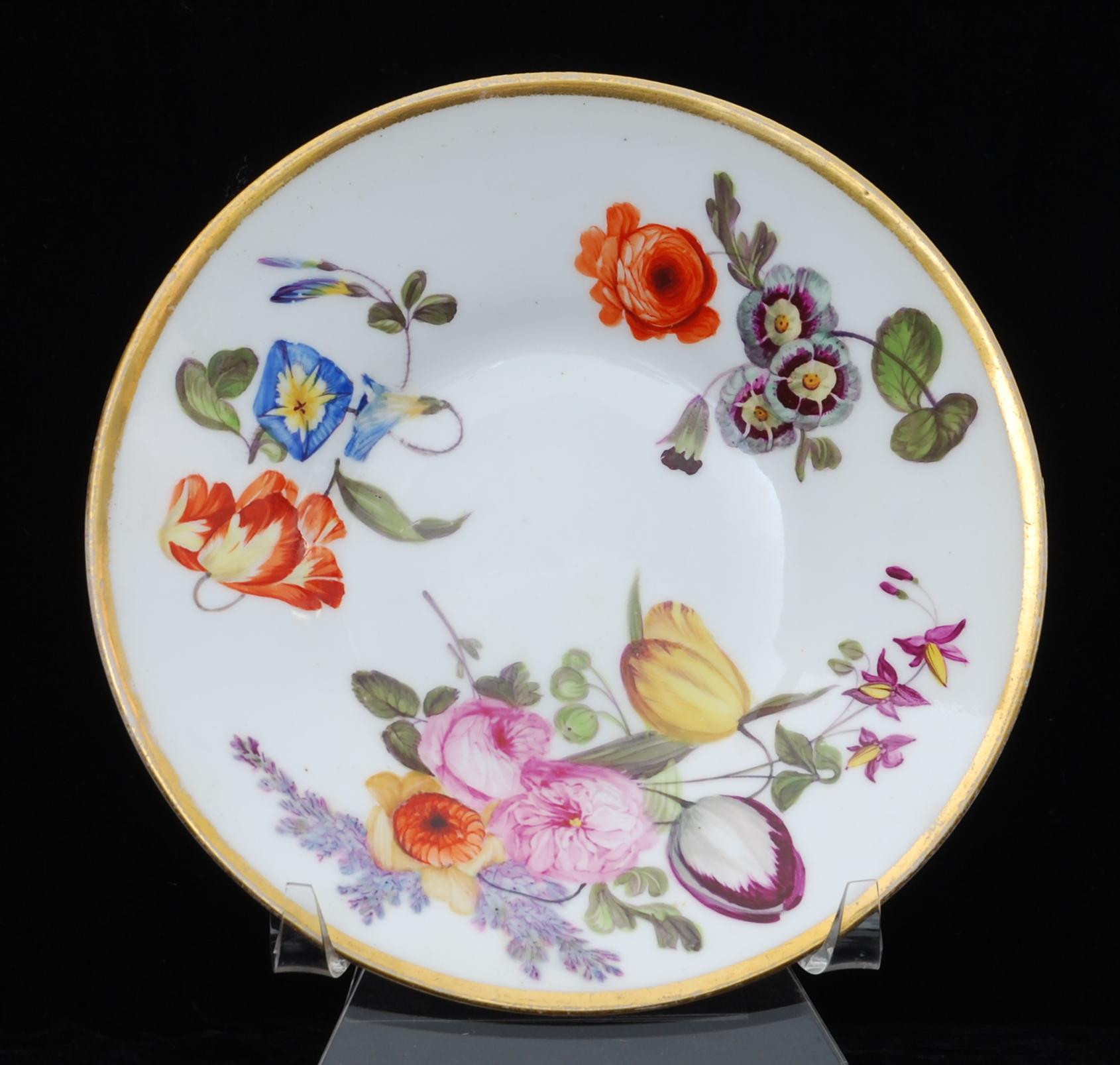 A rare tea cup and saucer in Nantgarw’s superb soft-paste porcelain. Each piece is gilded and decorated in one of the London workshops with superb flower painting, probably by Moses Webster.

The Nantgarw factory lasted only a few years, but their