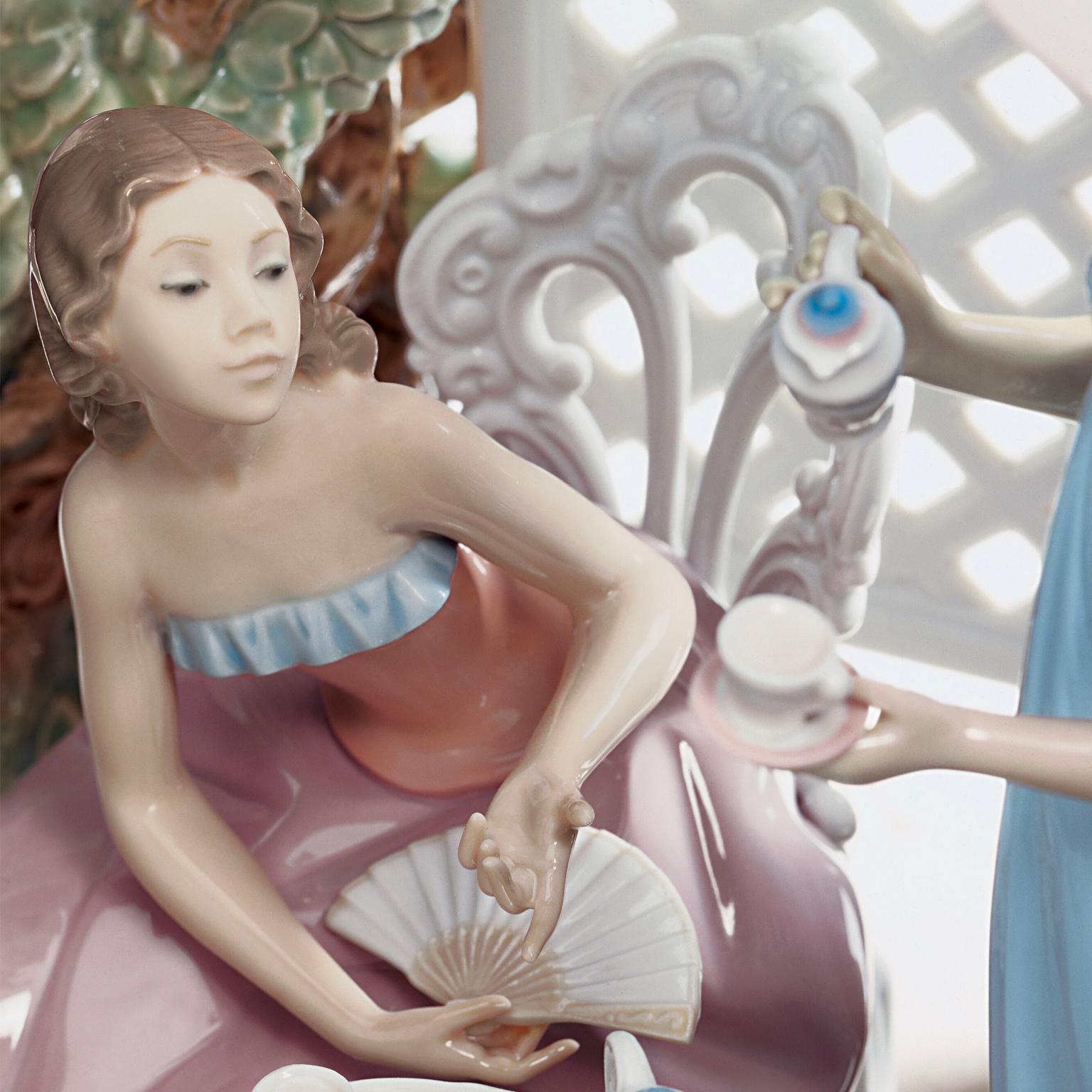 Limited edition sculpture of women drinking tea, decorated with handmade gloss finish porcelain flowers.
Lladró figurines often reference a timeless Romanticism, an undefined but still extremely familiar world in space and time. Here, we find all