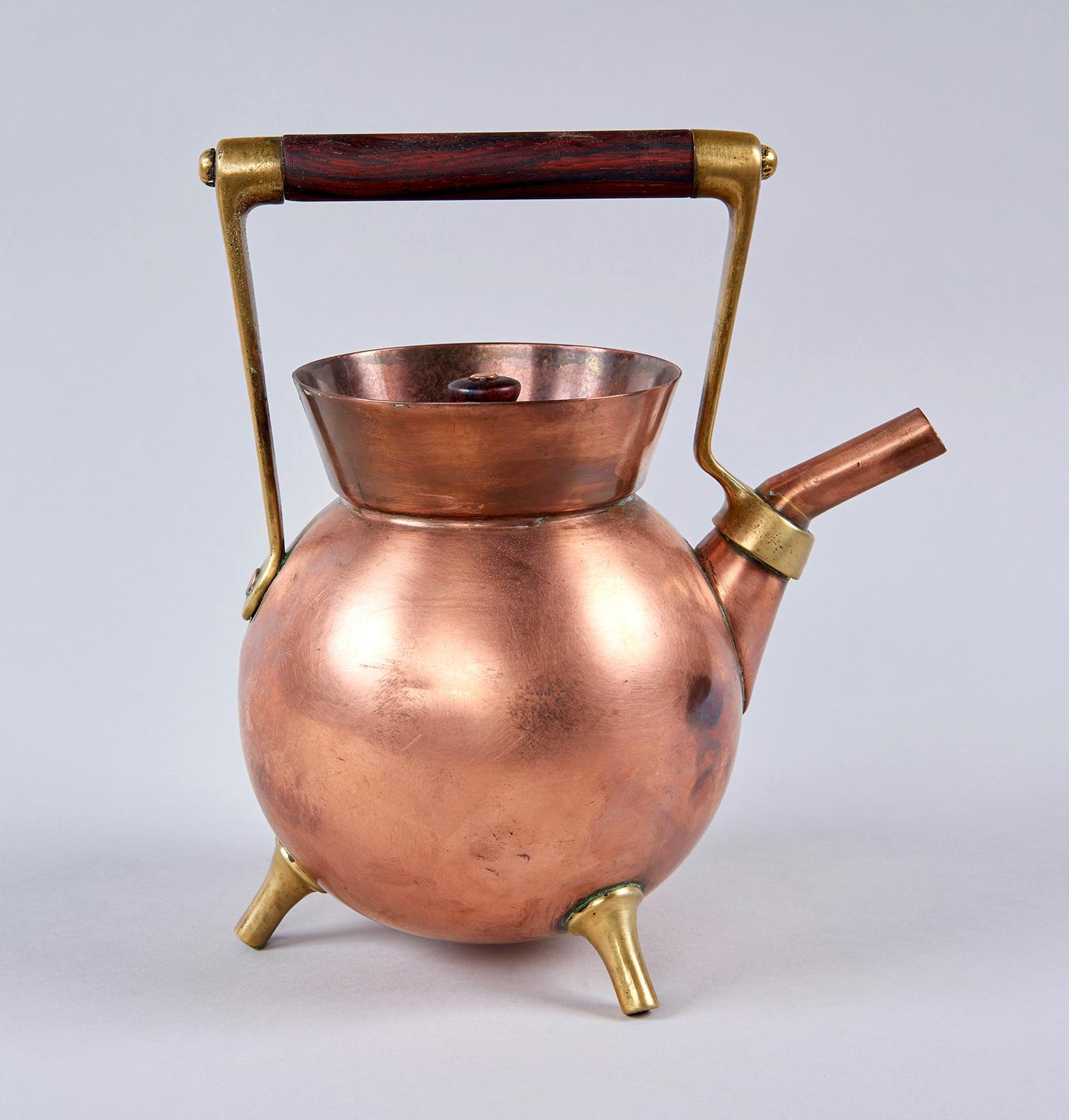 Unusually geometric in form, this extraordinarily inventive copper and brass kettle looks like a Bauhaus thesis project from 1930 but was actually created in England in 1878 by the world's first industrial designer, proto-modernist Dr. Christopher