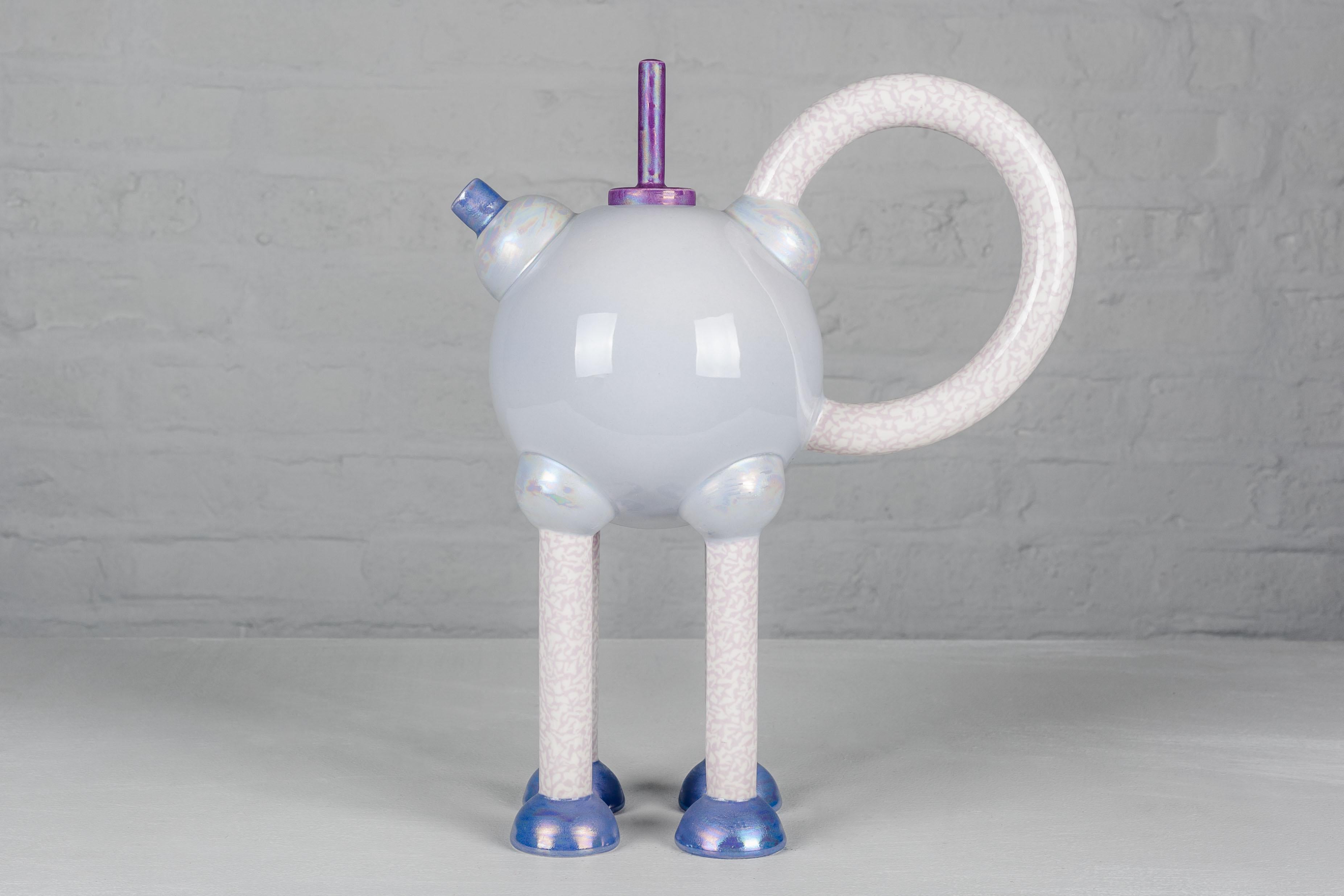 The Columbina Superba tea pot was designed by Matteo Thun for Memphis in 1982 (now out of production). This is a rare Artist proof: the iridescent blue color on the spout and the feet is specific to this very limited edition of Artist Proofs.

H