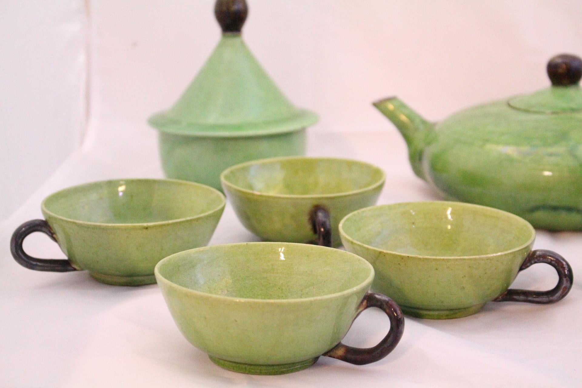 French Studio Pottery Tea Service by Dieulefit Provence, France, circa 1960-1970
Attributed to Roger Mourre
Green Faience
Measurements given are for the teapot
14 pieces in overall good vintage condition some pieces have small minor old