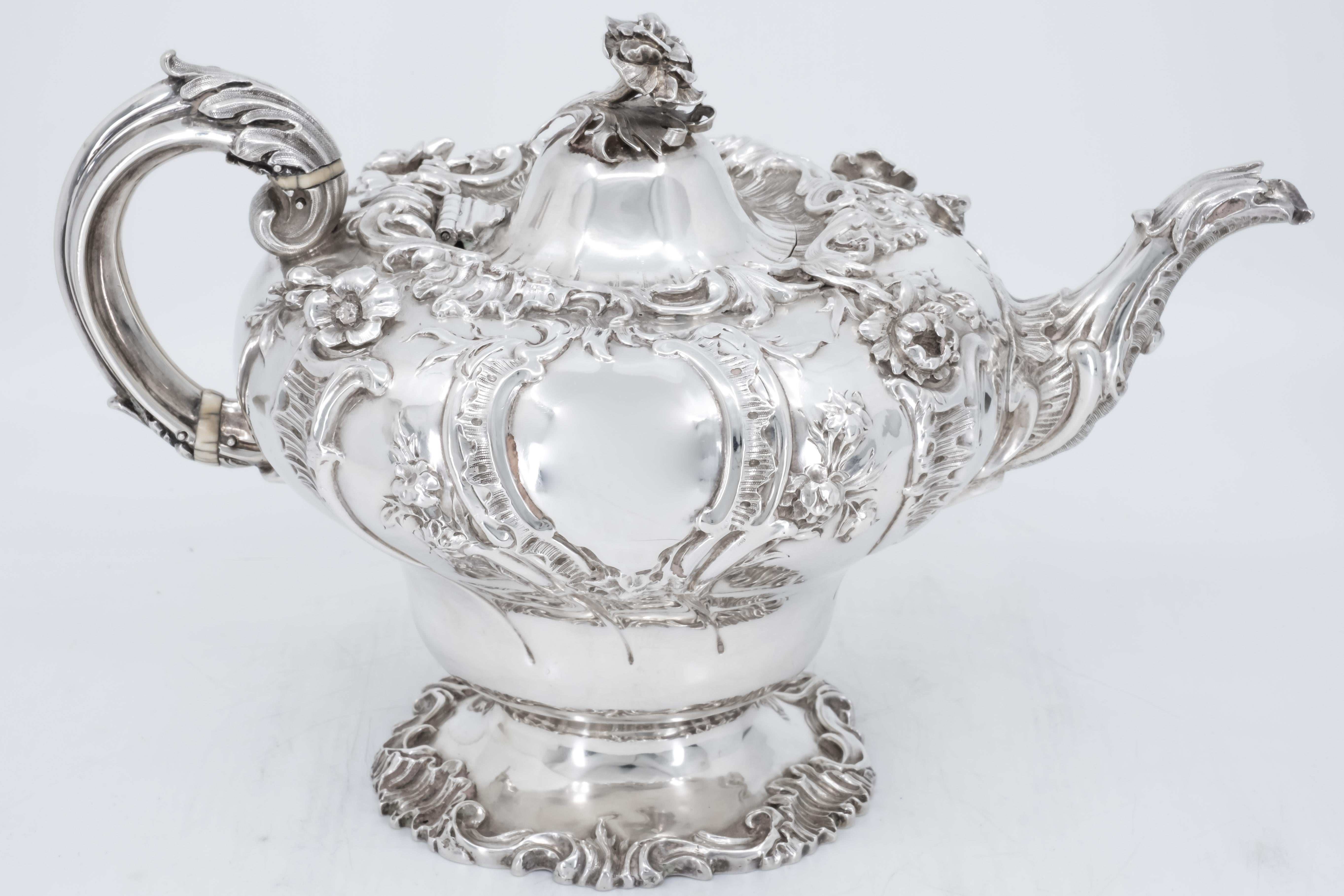 A three-piece sterling sliver tea services in the Rococo style.

All three pieces display a gift wash interior, and hallmarked with the following five marks; 
(1) Marker ''CF'' for Charles Fox.
(2) Standard quality mark for Sterling sliver (the