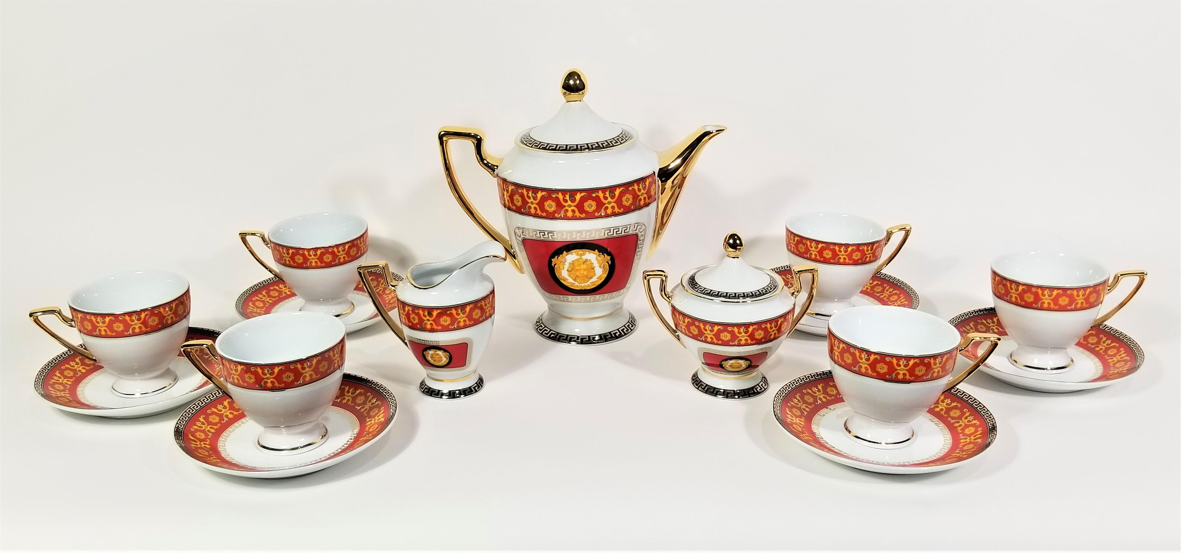 Mid century tea set or coffee set. White porcelain with gold accents. Red yellow and black design. Greek Key design. All pieces are marked Imperial Japan Design. 15 pieces total.
Excellent condition 

Measurements:
Tea pot height: 9.0