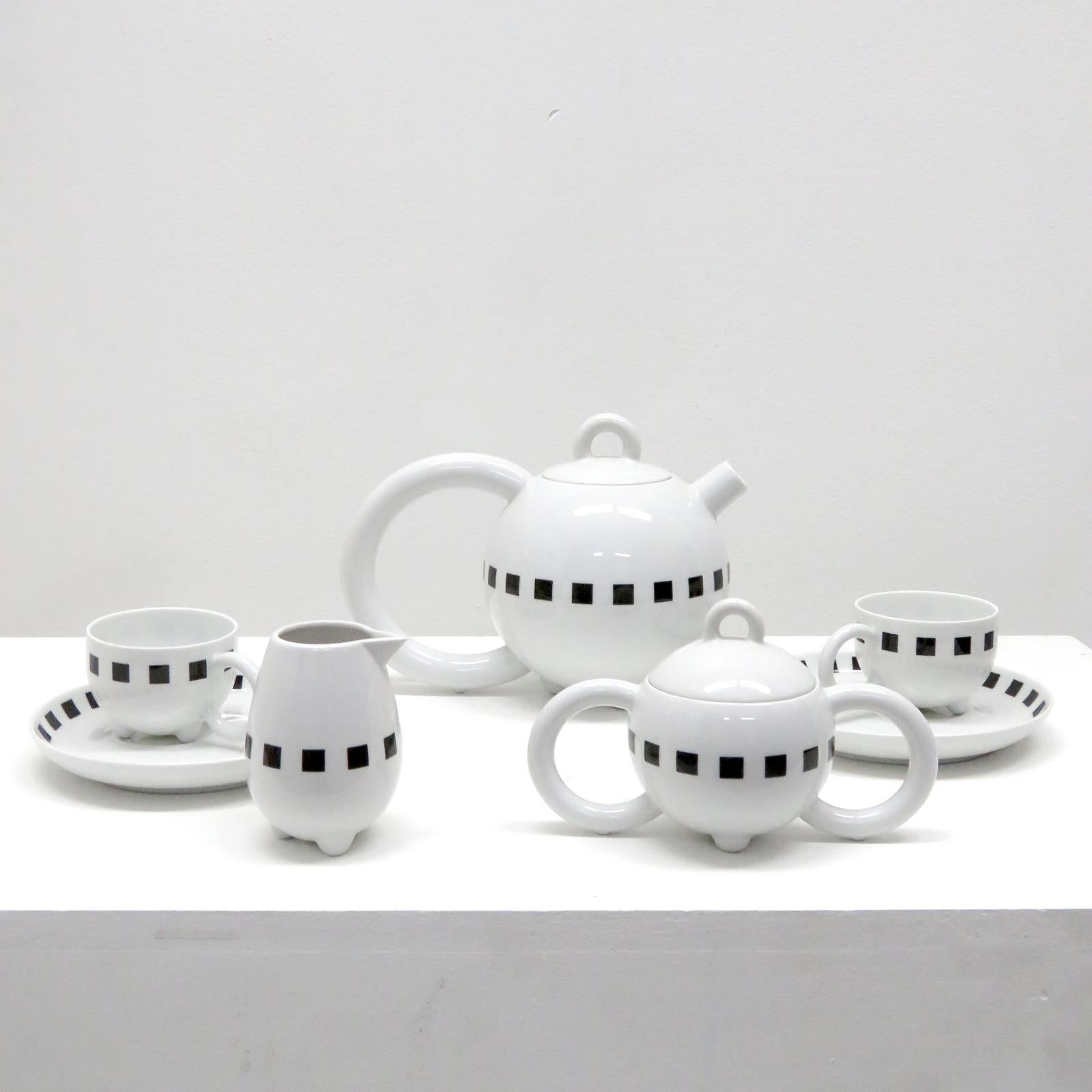Stunning Memphis-style Seven-piece porcelain tea set 'Fantasia' with 'Carre Noir' decor by Matteo Thun for Arzberg Porzellan, Germany. The set contains a tea pot with lid, two cups with saucers, a milk vessel and a sugar container with lid, marked