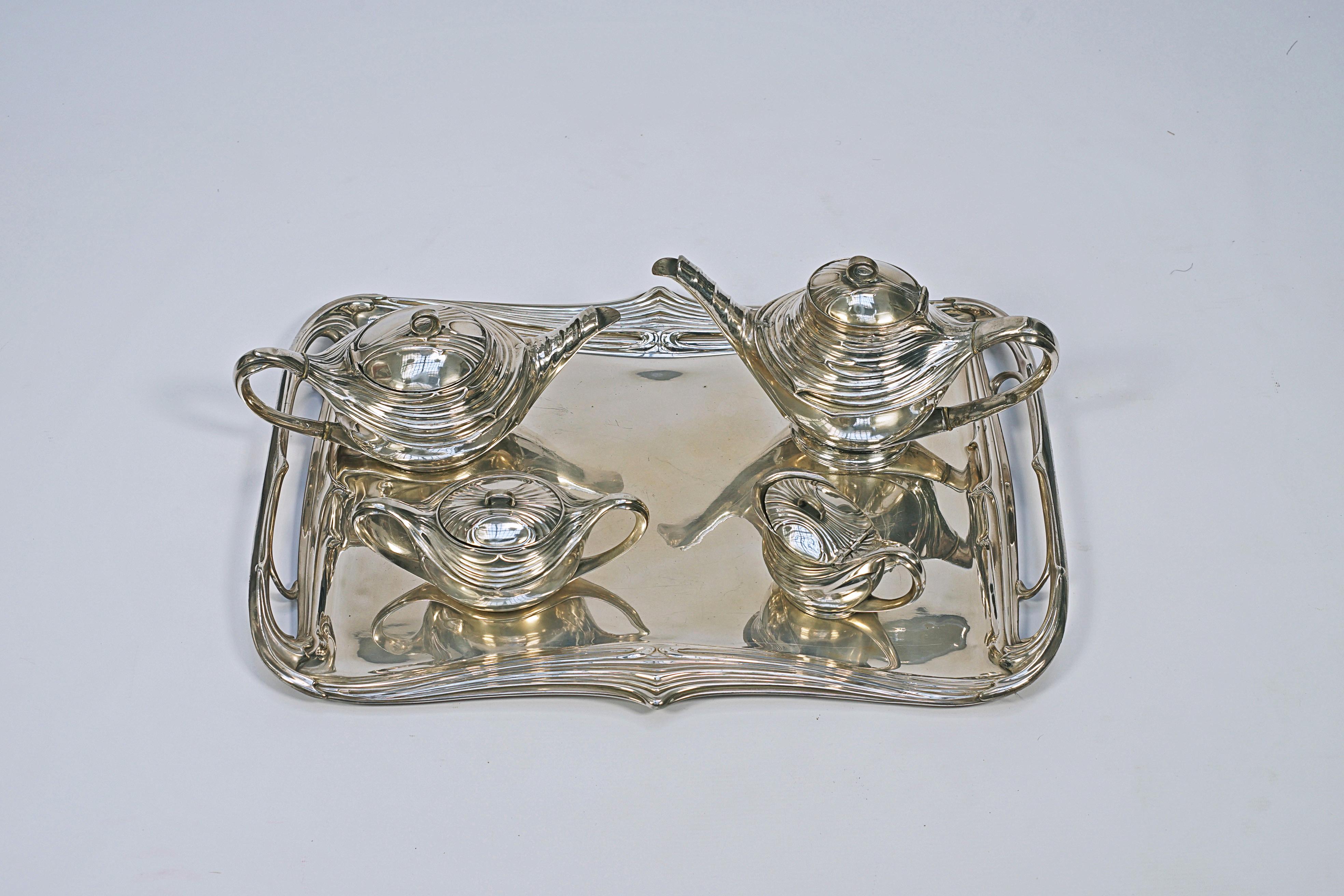 Silver-plated bronze tea and coffee set, 5 pieces, model 149. Made by the WMF-Württembergische Metallwarenfabrik (1853 to the present).

“Art Nouveau Domestic Metalwork, from Wurttembergische Mettalwsarenfabrick” (1906), Graham Dry. P -