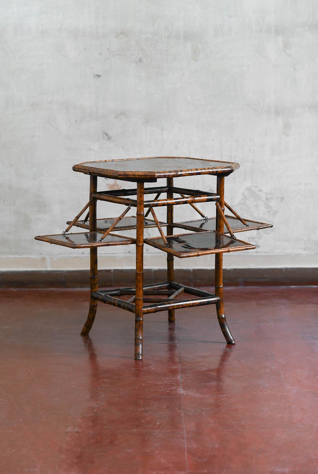 “Tea table” in bamboo and lacquered wood, attributed to Perret & Vibert, France late 19th century.  
Product details
From the residence of Antonello Falqui – Falqui Collection.
Quadrangular top with truncated corners and four drop-leaf shelves