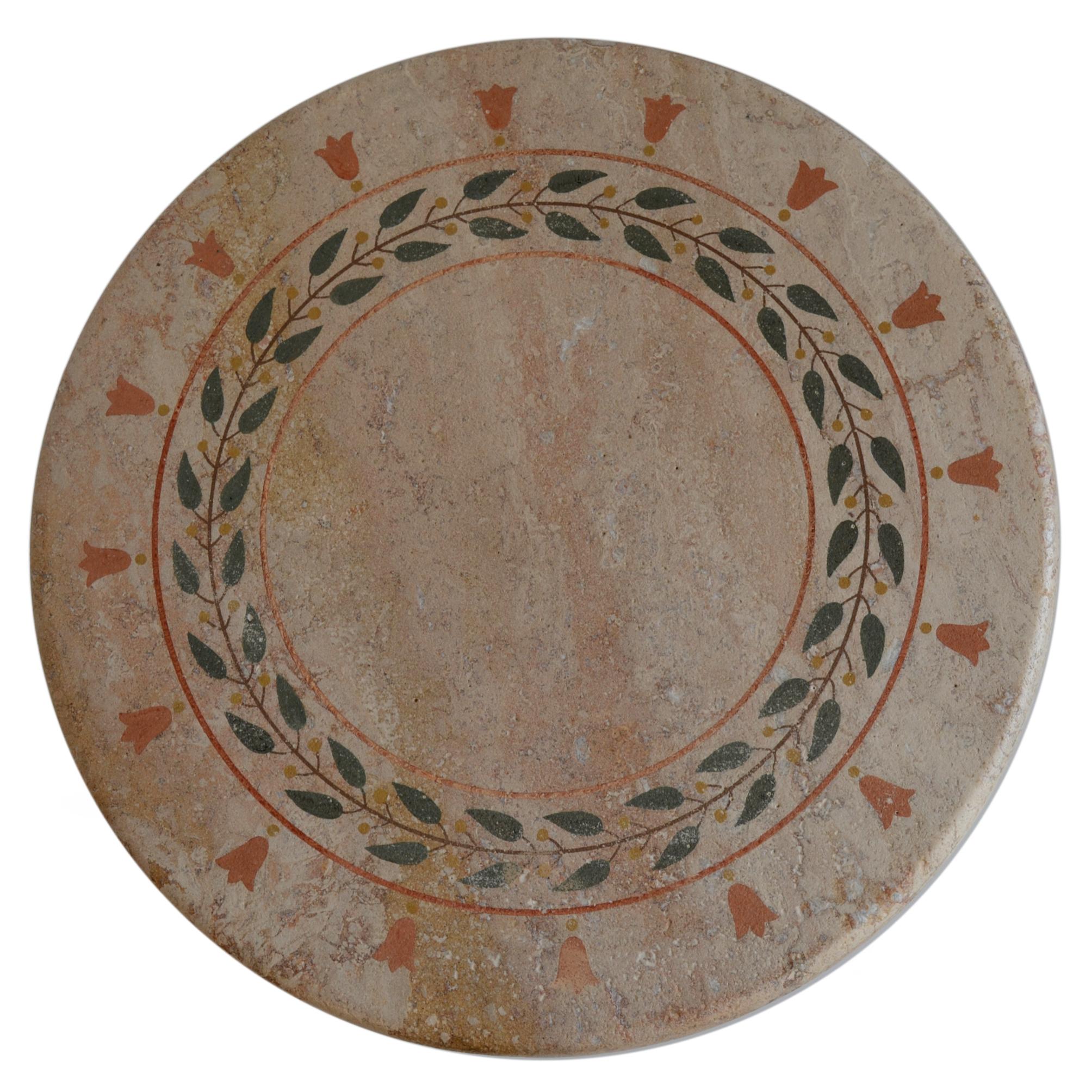 This table can be used as tea table, side table, lamp table it has multiple uses.
The top is manufactured in Travertine decorated with scagliola art inlays, technique of the 16th century. The classical decoration stands on a simple iron base in a