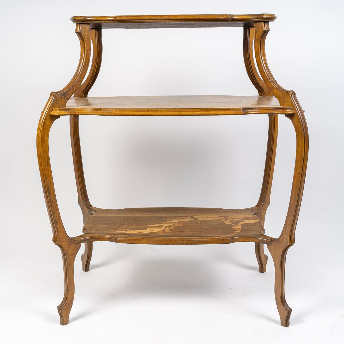 Tea table with 3 trays by Emile Gallé, Art Nouveau, circa 1900.

Tea table by Emile Gallé, Art Nouveau period, 1900, with three marquetry trays decorated with vegetation and butterflies, ‘Gallé’ signature in the decoration.
h: 84cm, w: 68cm, d: 48cm