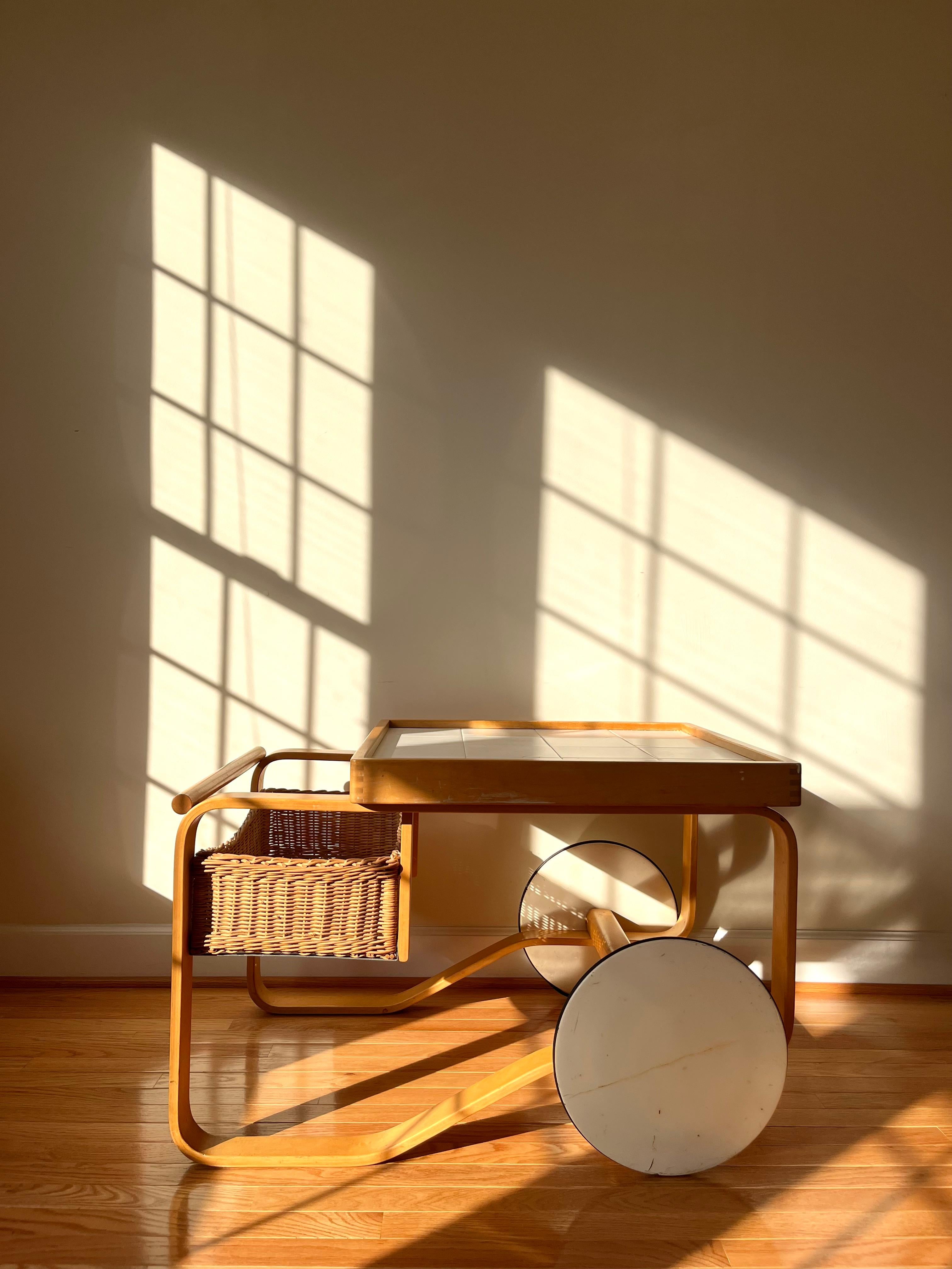 The tea trolley was inspired by British tea culture, which Aino and Alvar Aalto had become acquainted with though their many travels, as well as by the Japanese woodwork and architecture they admired. 
The striking Tea Trolley 900, which features
