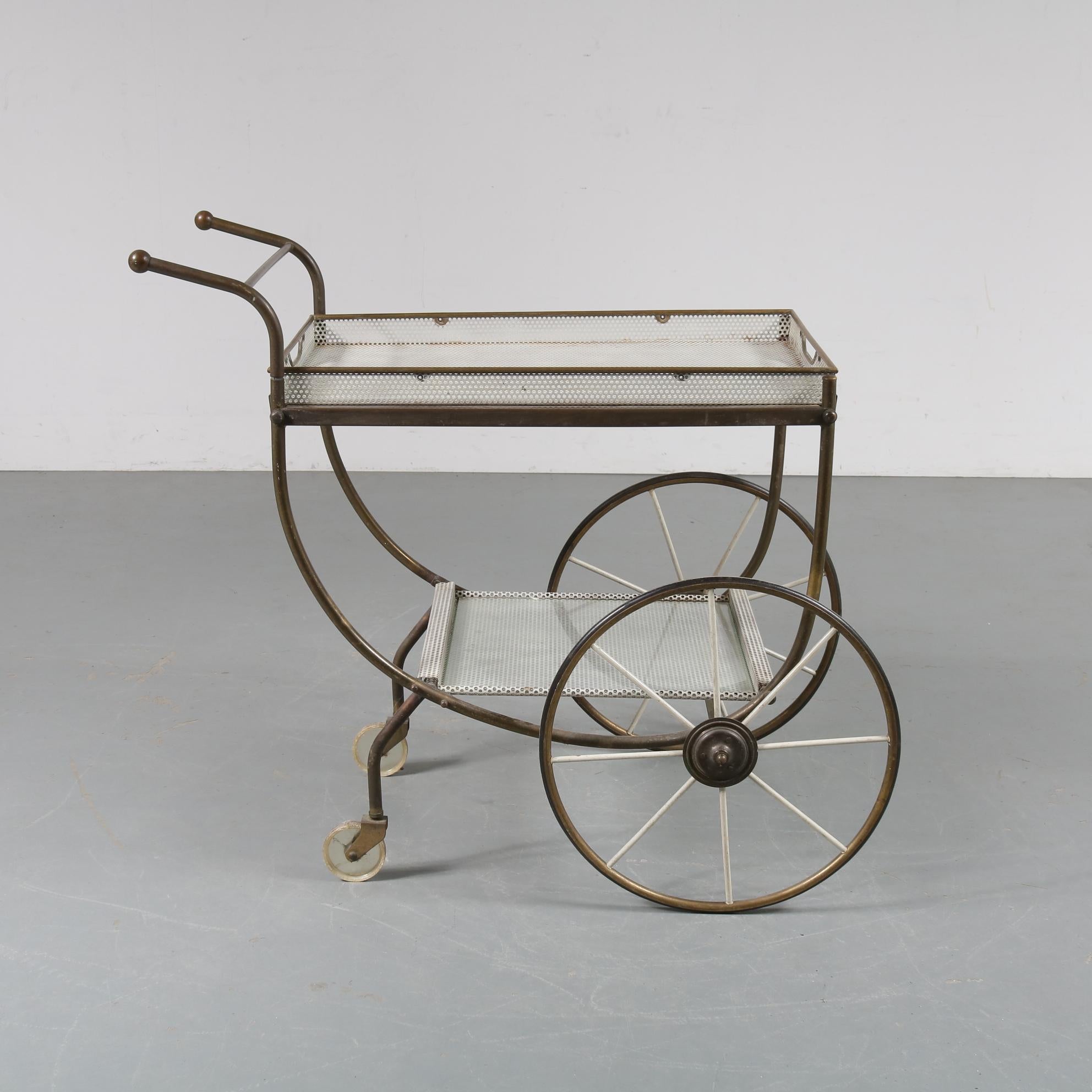 Luxurious tea trolley bar cart, manufactured in Sweden by Svenskt Tenn, circa 1950.

This elegant piece is made of beautiful quality brass, giving it a very classy appearance. It stands out with its amazing details in the design. It has two