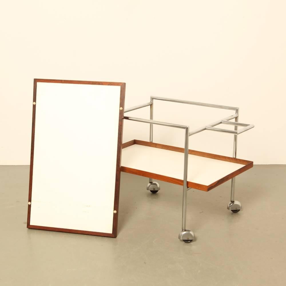 For Pedersen and sons

also ideal as side table

wood and chrome-plated metal

both shelves can be lifted out and thus be used as serving trays.