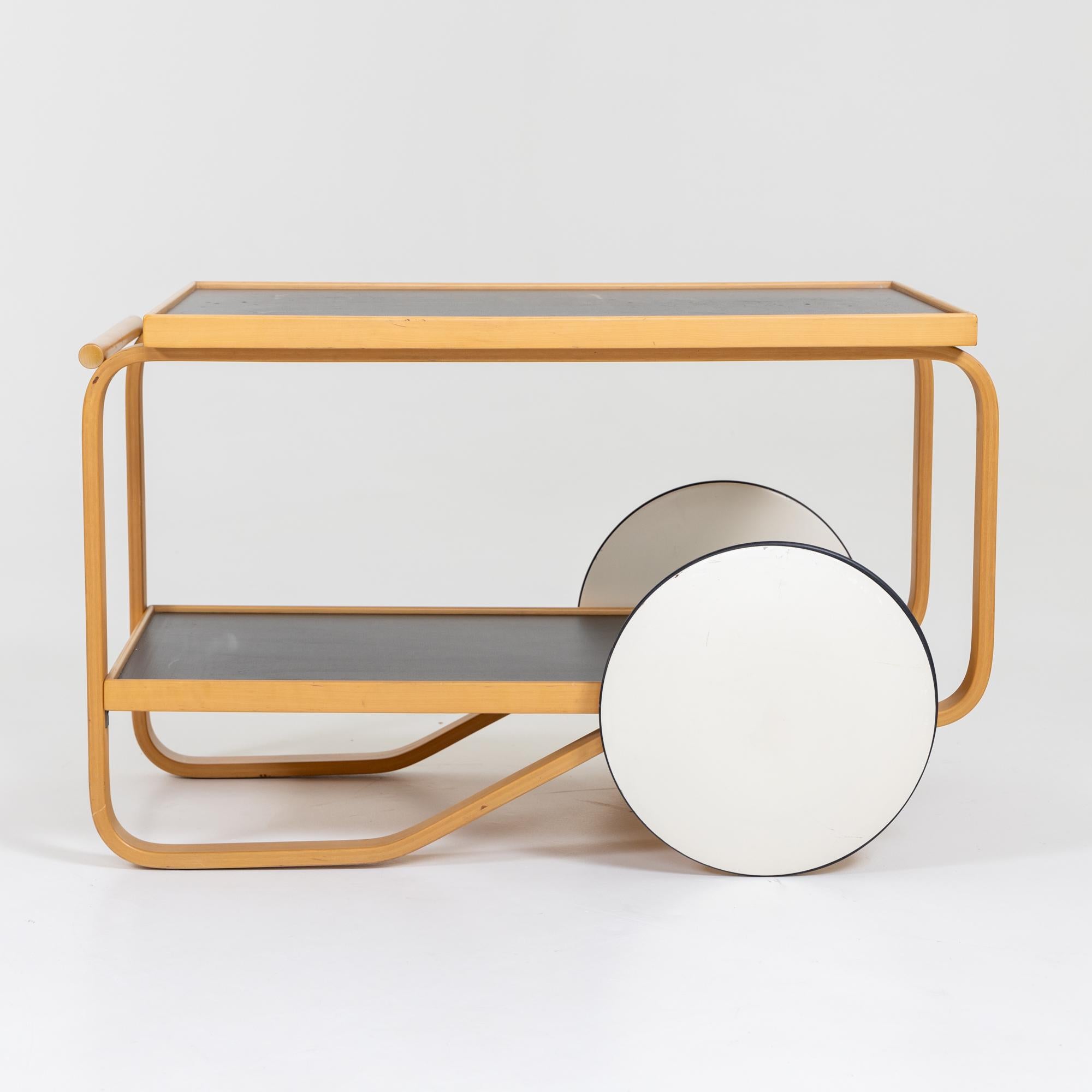Beech tea trolley with white disc wheels and black shelves.