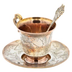 Teacup with saucer and spoon in gilded silver with engraved plant motifs