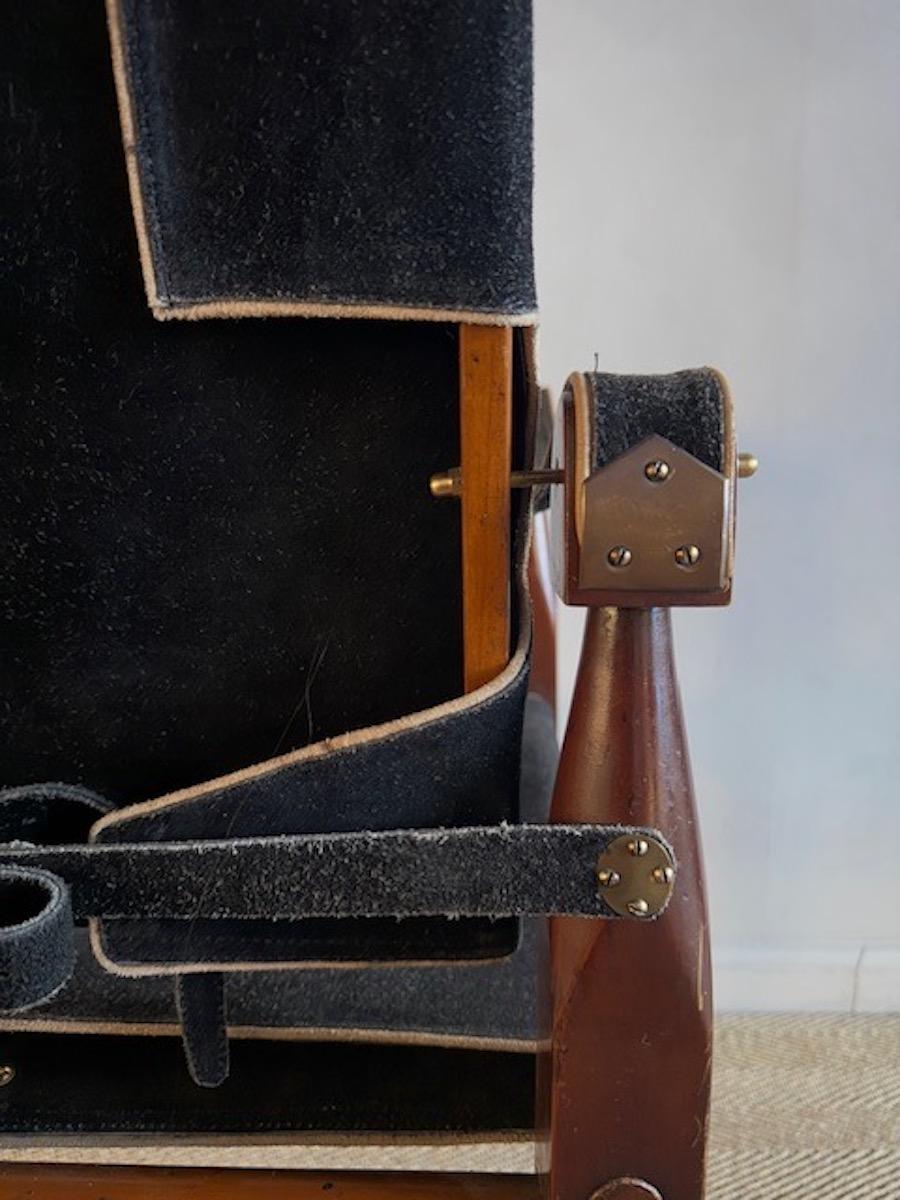 Teak and black suede Safari chair with contrast piping and beautiful details, Northern Europe 1950's. This chair in the style of Kaare Klint 