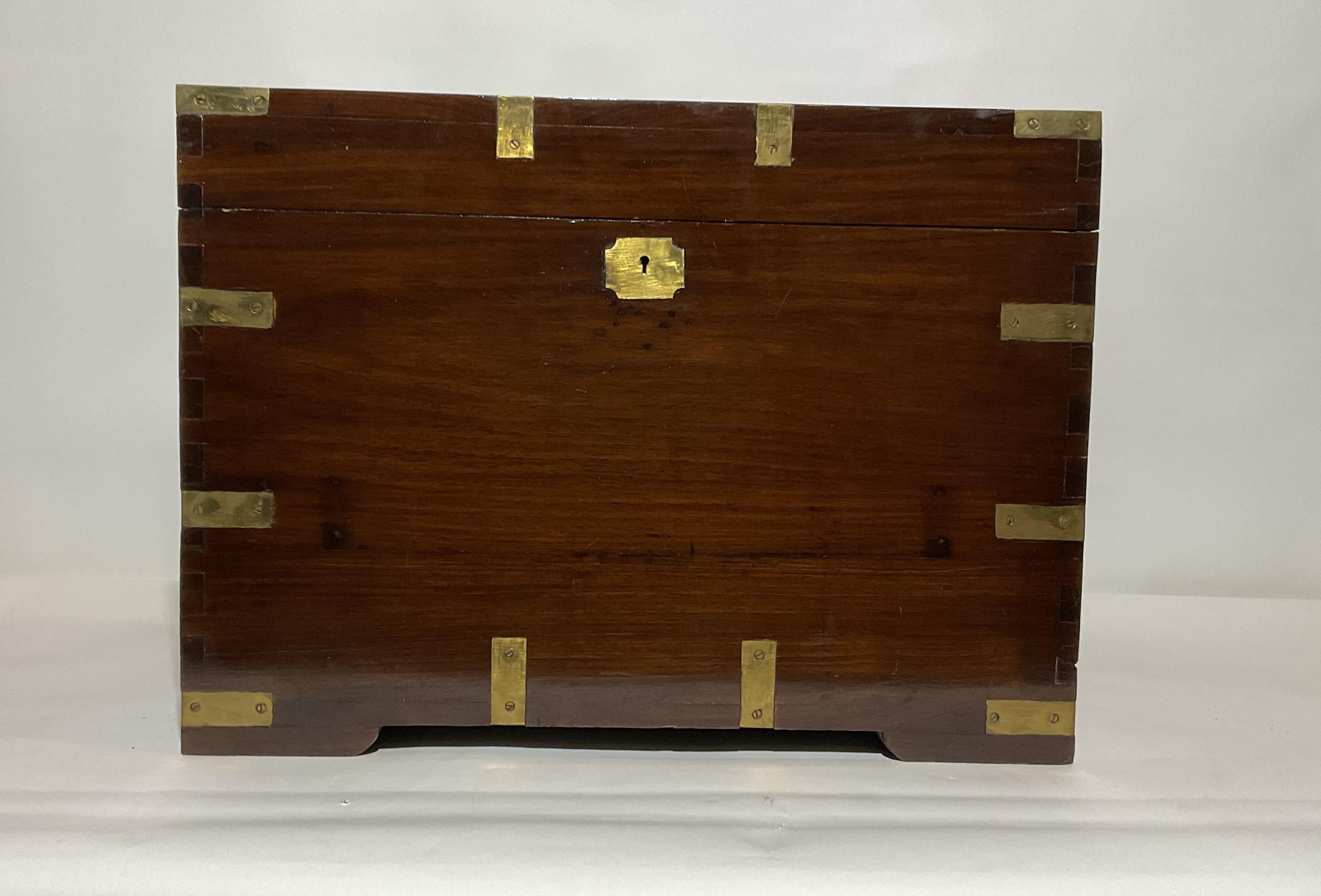 Teak and Brass nautical chest with inlaid brass corners, inlaid keyhole brass, carry handles, corners. etc.,

Weight: 36 lbs.
Overall Dimensions: 17