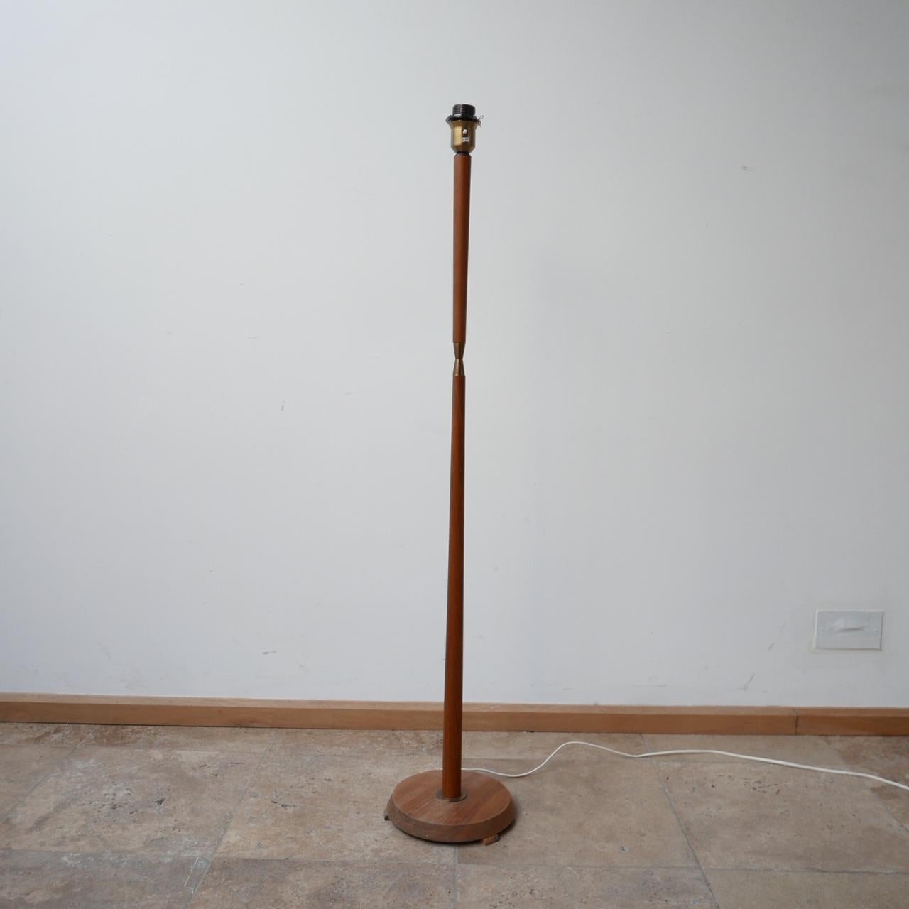 A teak floor lamp with stylish brass central detail. 

Sweden, c1960s. 

Original lamp shade retained for reference but likely wants updating. 

Since re-wired and PAT tested.

Dimensions are without the shade. 

Location: London Gallery.