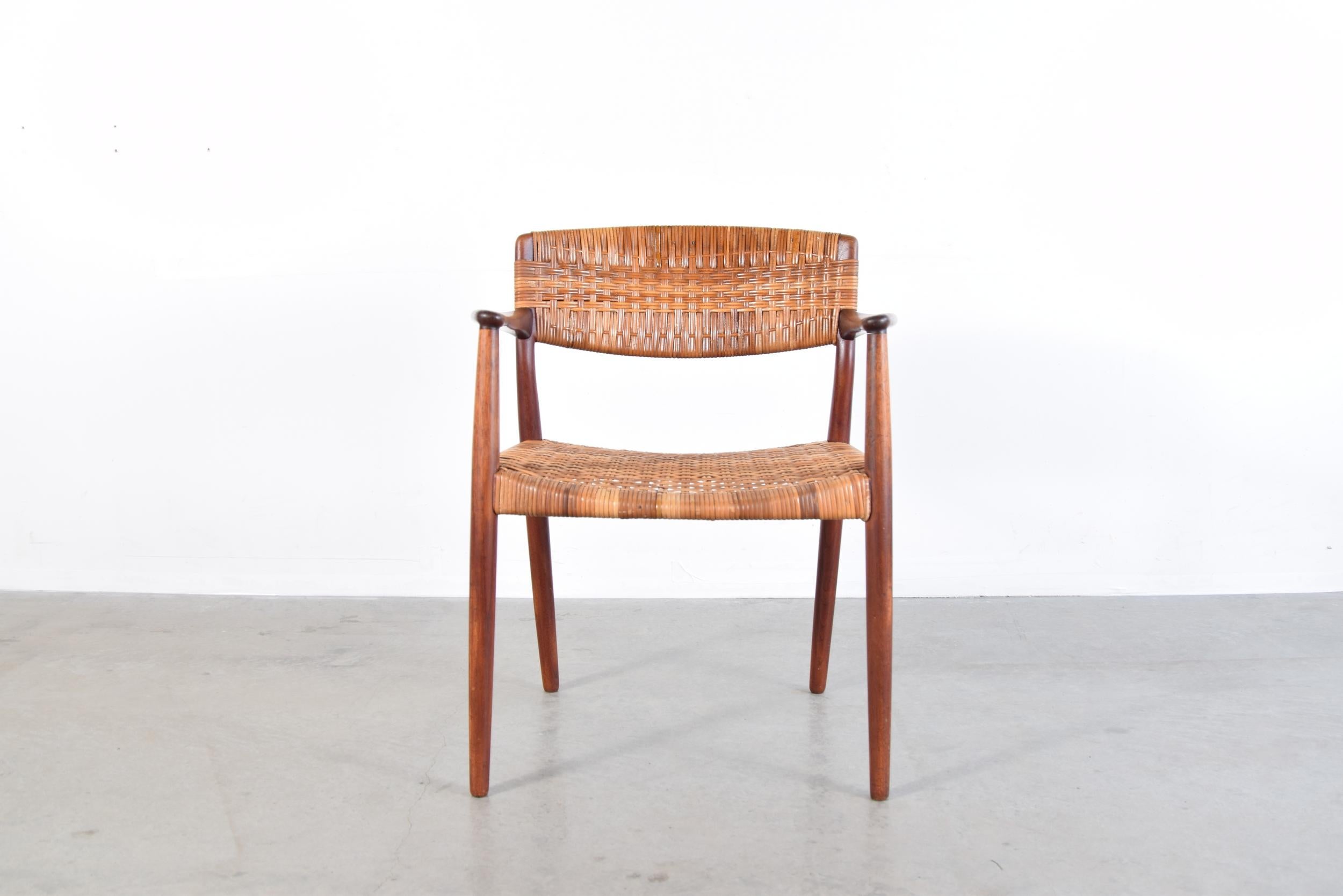 Teak and cane armchair, designed by Ejner Larsen & Aksel Bender Madsen. Produced by Willy Beck in Denmark, circa 1950s.

Arm height is 26 1/2