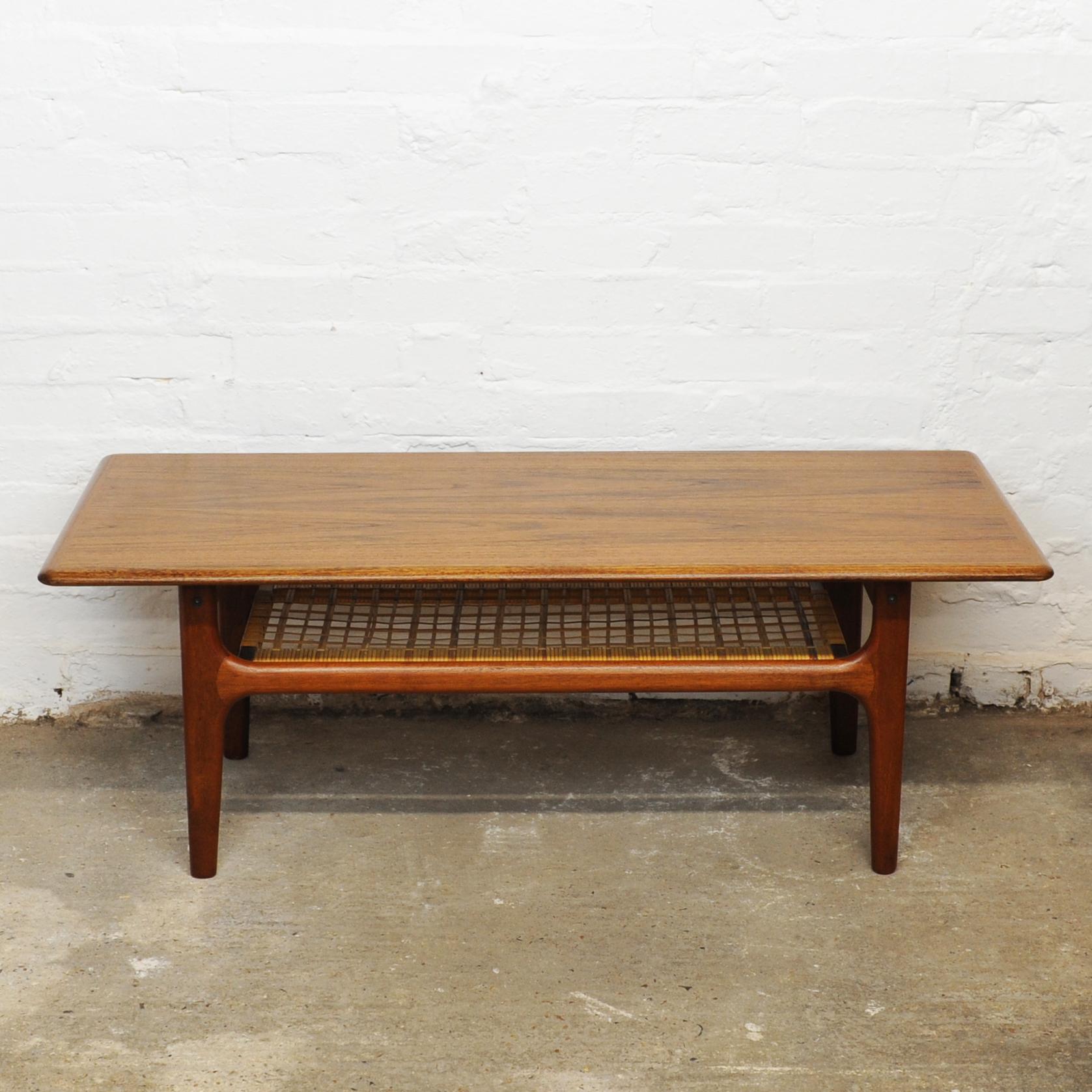 A 1960s teak and cane Danish coffee table by Trioh Mobler.

Manufacturer - Trioh Mobler

Design Period - 1960 to 1969

Country of Manufacture - Denmark

Style - Mid-Century

Detailed Condition - Good with minimal defects.

Restoration and Damage