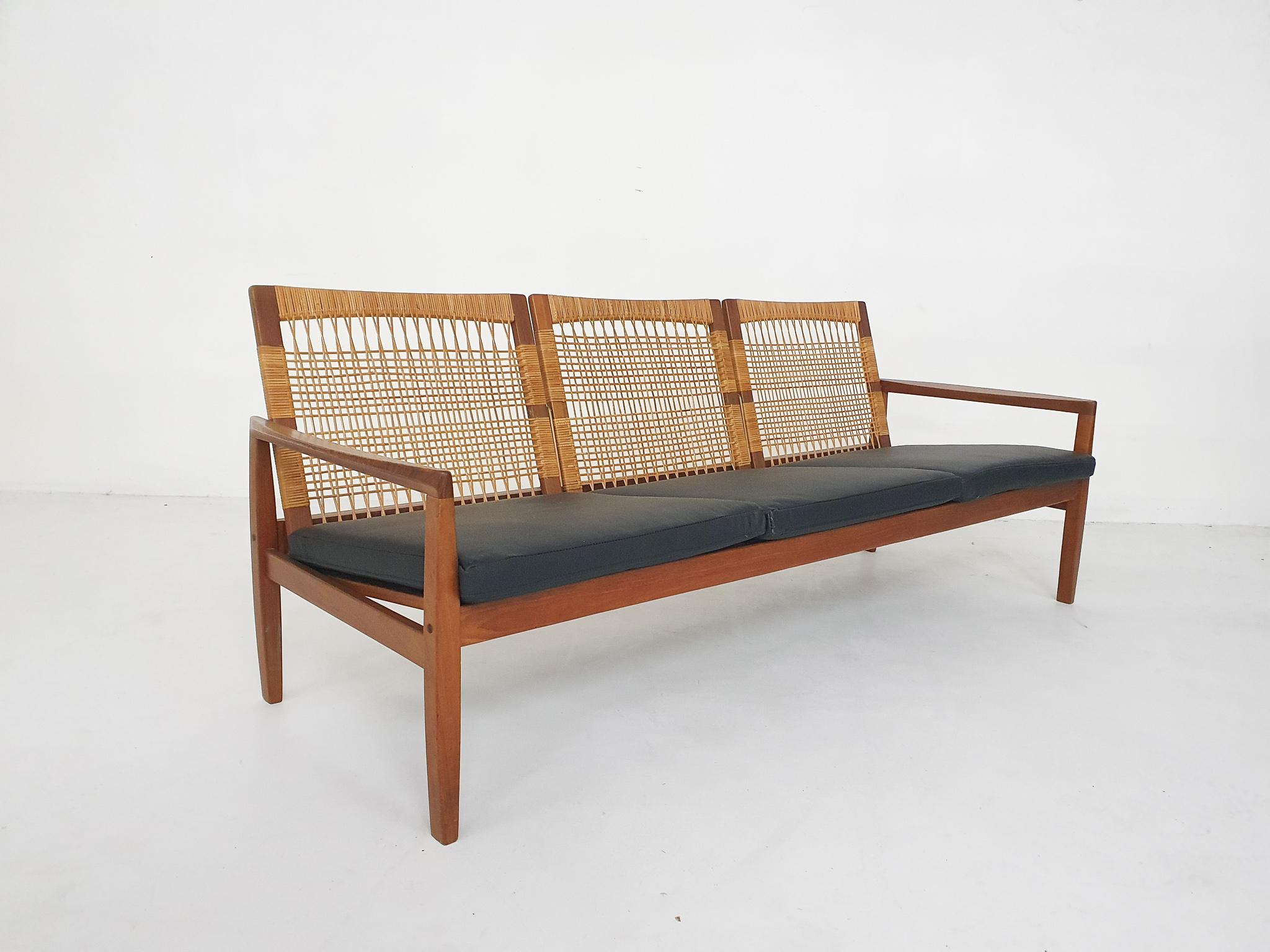 Indulge in timeless elegance with our vintage design sofa crafted by the iconic Hans Olsen and produced by Juul Kristensen. This exquisite piece from the 1950's seamlessly blends mid-century charm with contemporary appeal, featuring quality teak