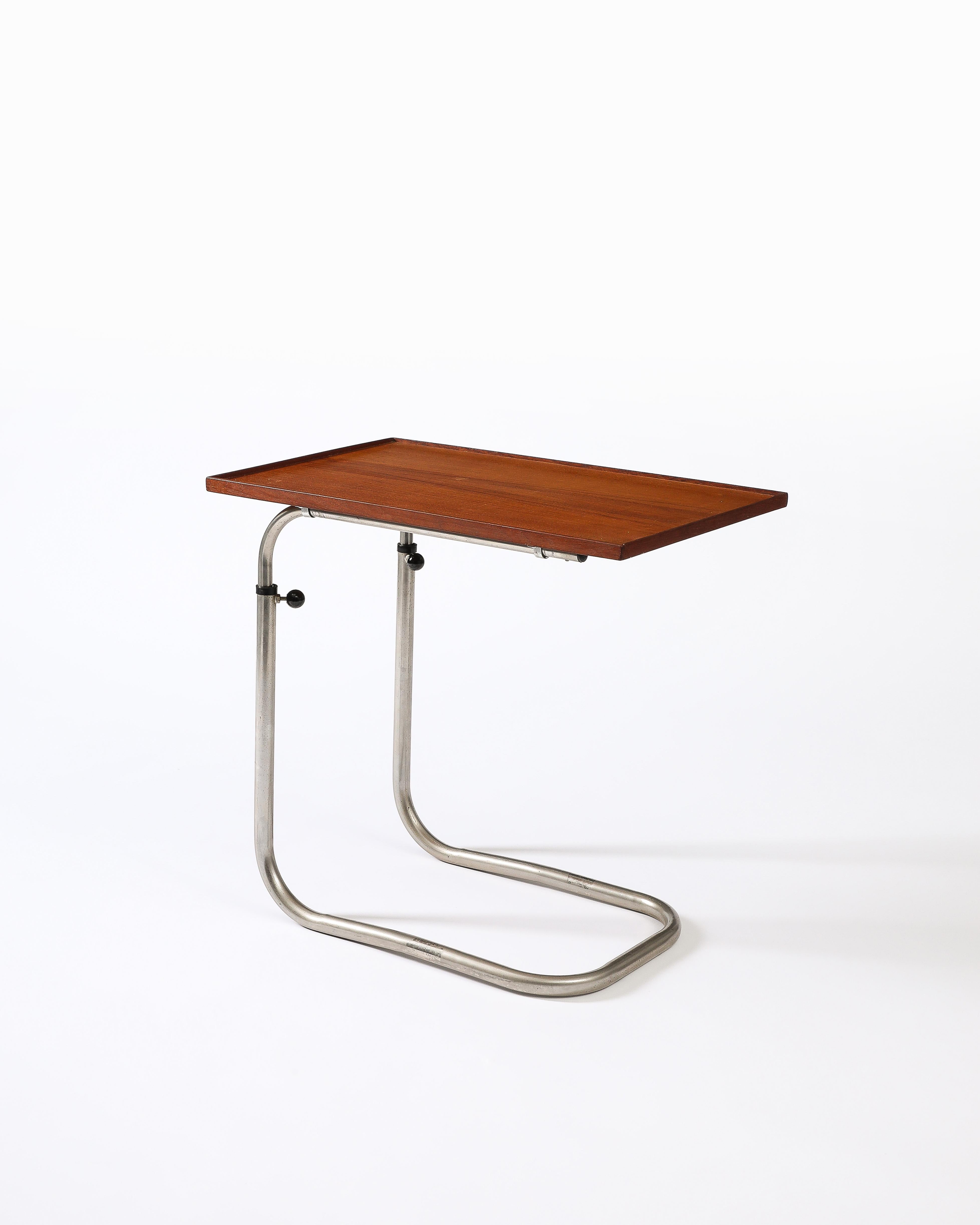 Adjustable table with a warm, well-kept teak tabletop. Cool, U-shaped support.