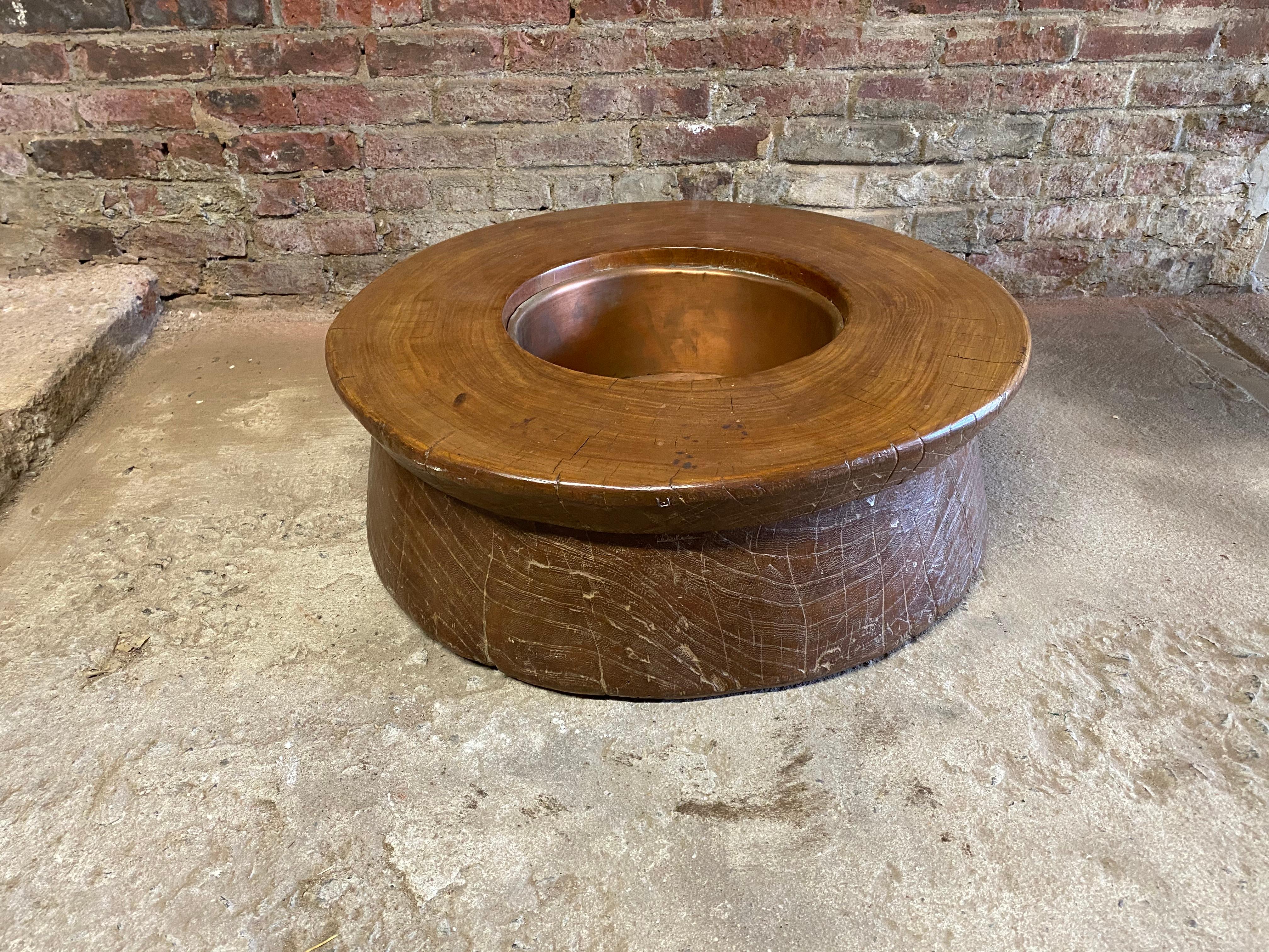 Solid teak Japanese Irori. The Irori is the traditional Japanese sunken hearth used for heating the home or food or most importantly the tea ceremony. This piece has a copper liner. Basically, this table was carved out of a very large tree stump,