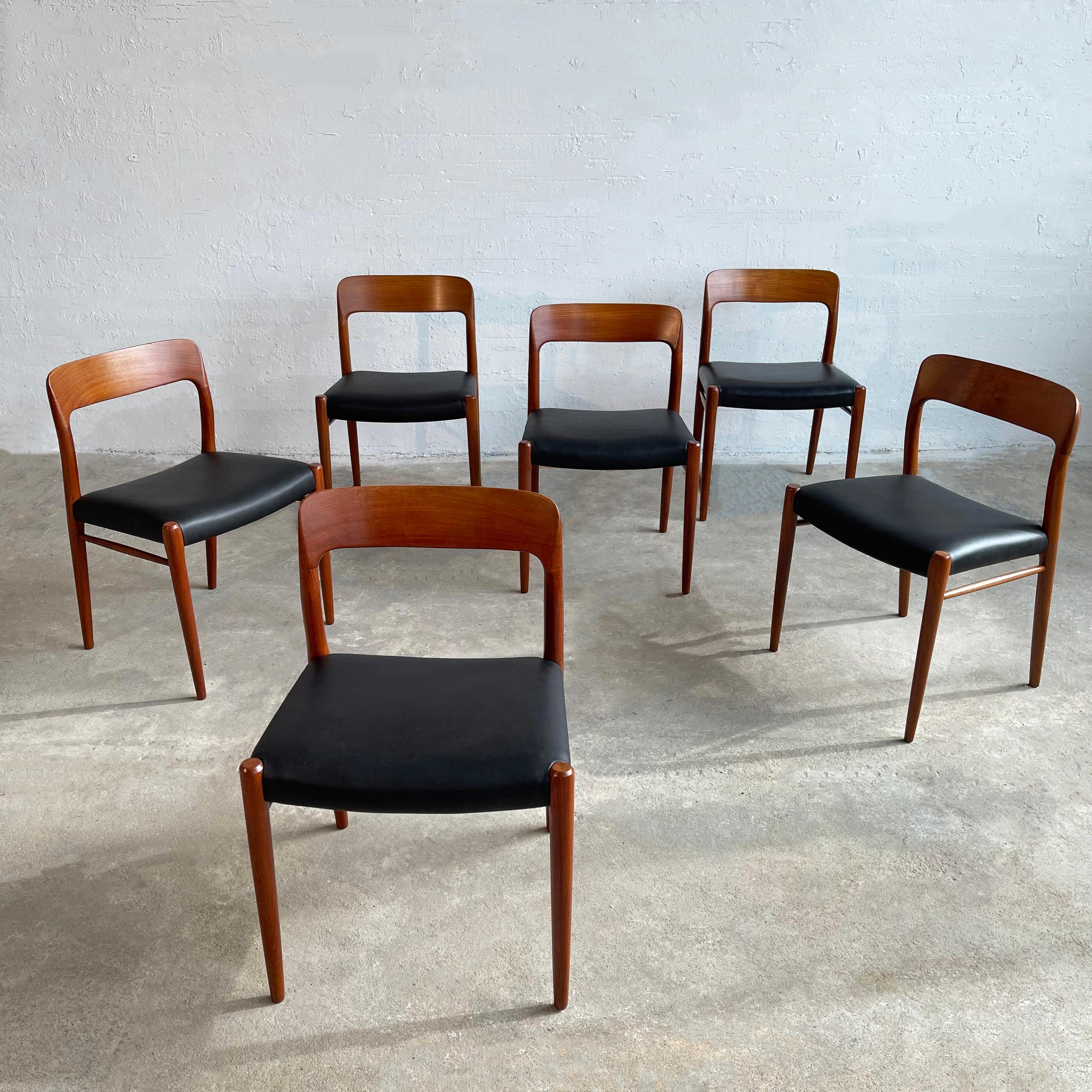 Set of six Scandinavian modern, model 75, teak dining side chairs by Niels O Møller for J.L. Møllers Møbelfabrik feature newly finished honey-toned teak frames with newly upholstered black leather seats with new webbing. Comfortable and iconic